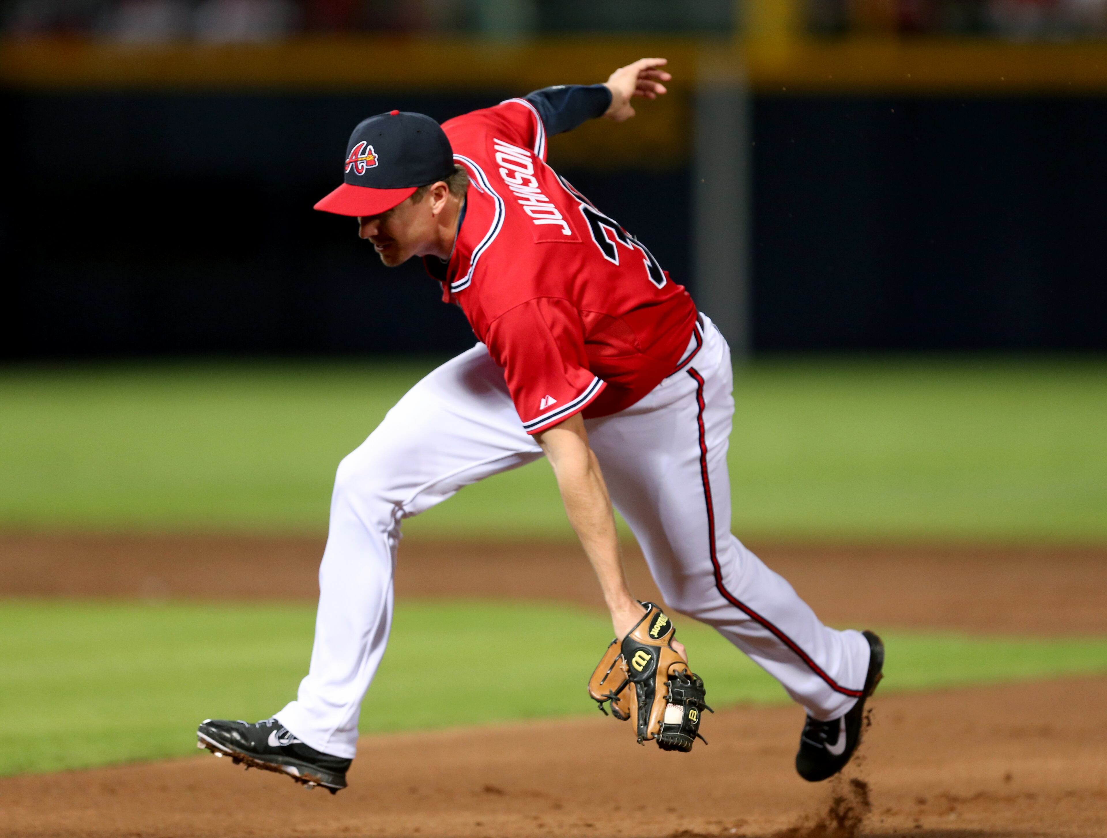 Braves second baseman Elliot Johnson (30) fields a ground ball for an out by a San Diego Padres batter in the 3rd inning of their game at Turner Field Friday night in Atlanta, Ga., September 13, 2013. JASON GETZ / JGETZ@AJC.COM
