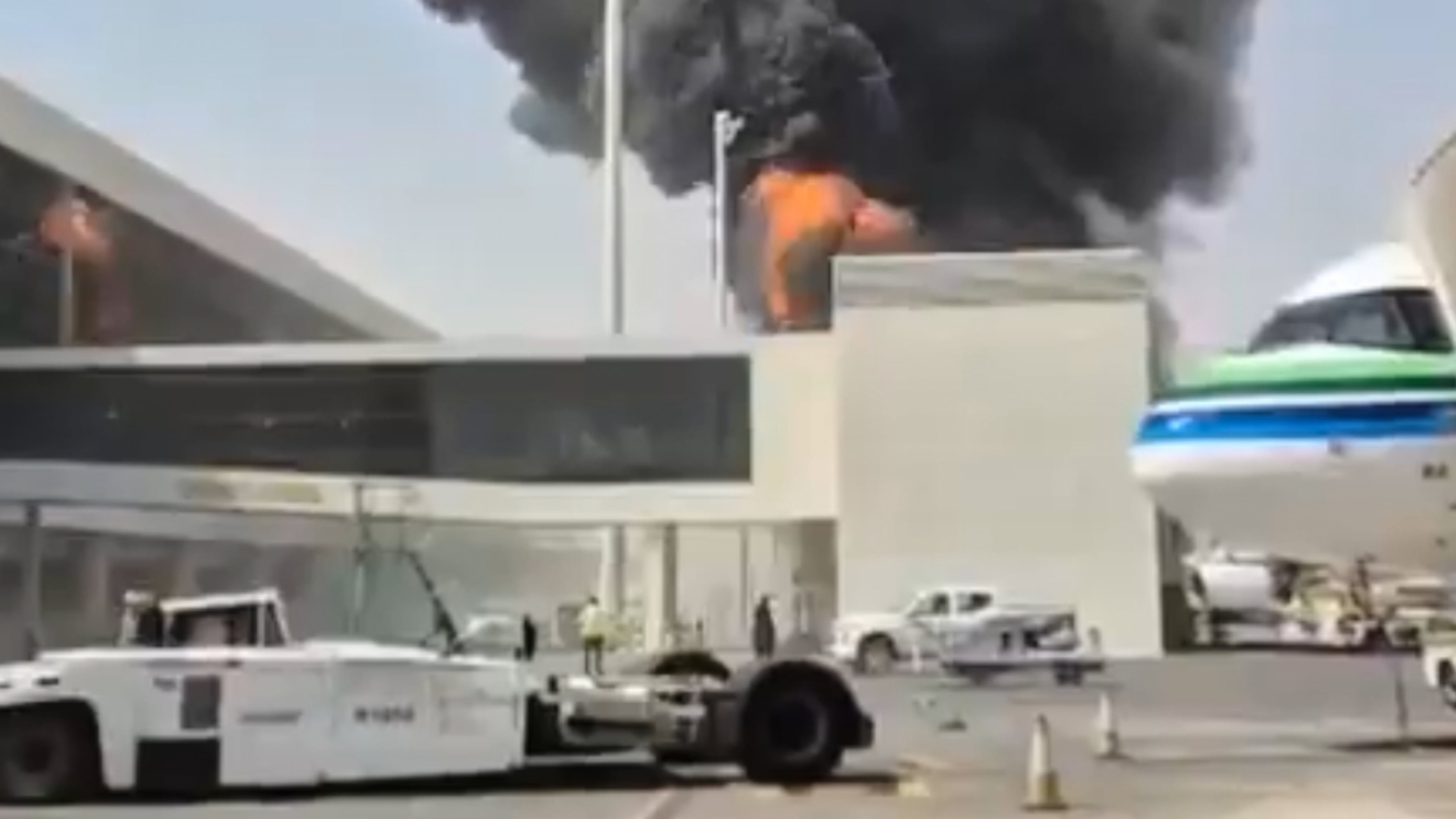This image from video obtained and verified by AP shows thick black smoke and flames rising from a fire at King Khalid International Airport in Riyadh, Saudi Arabia, Friday, Oct. 9, 2026. (UGC via AP)