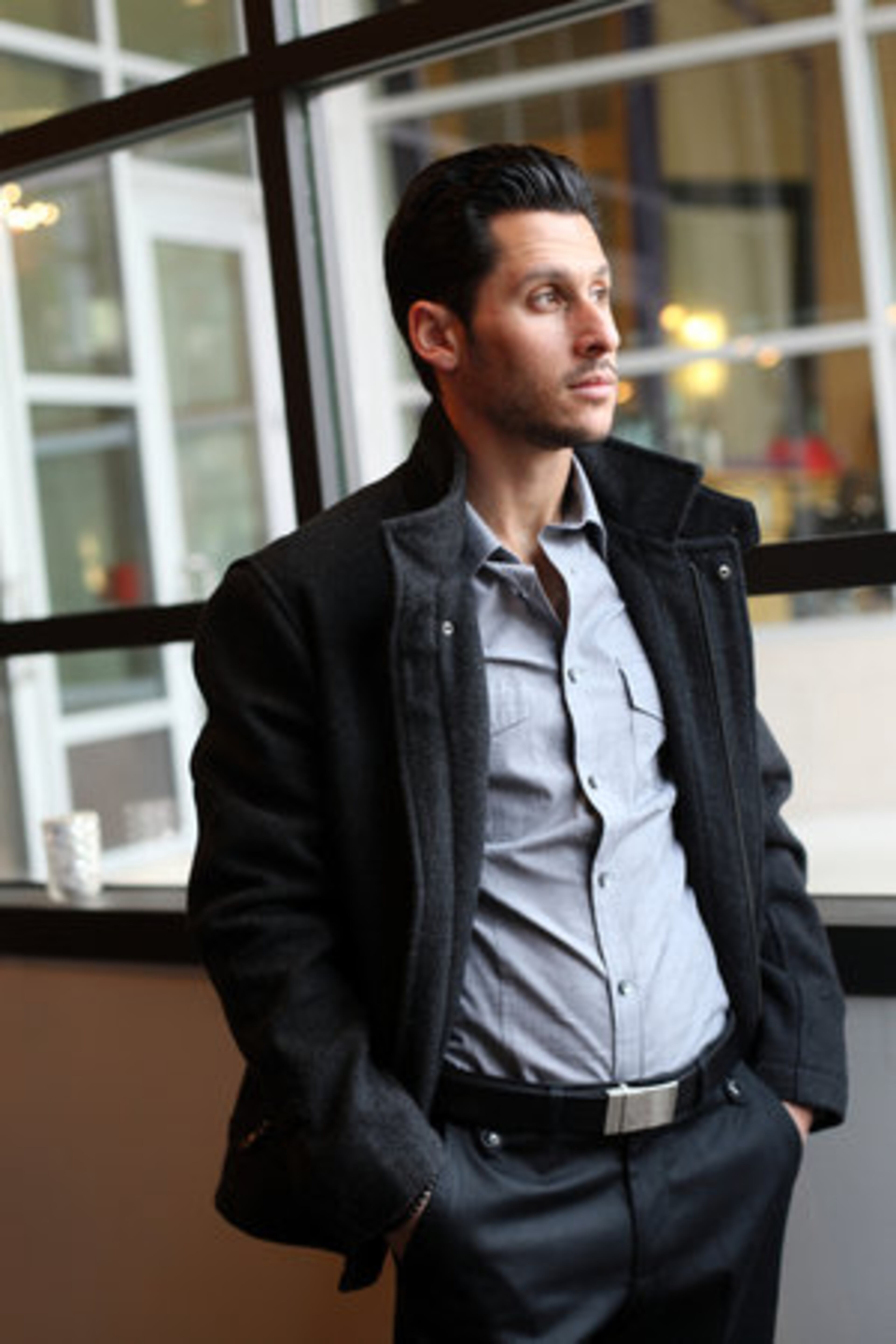 Epstein sports a wool peacoat from INC, along with an MK2 fitted dress shirt from Express and a pair of canvas and twill pants from Zara.