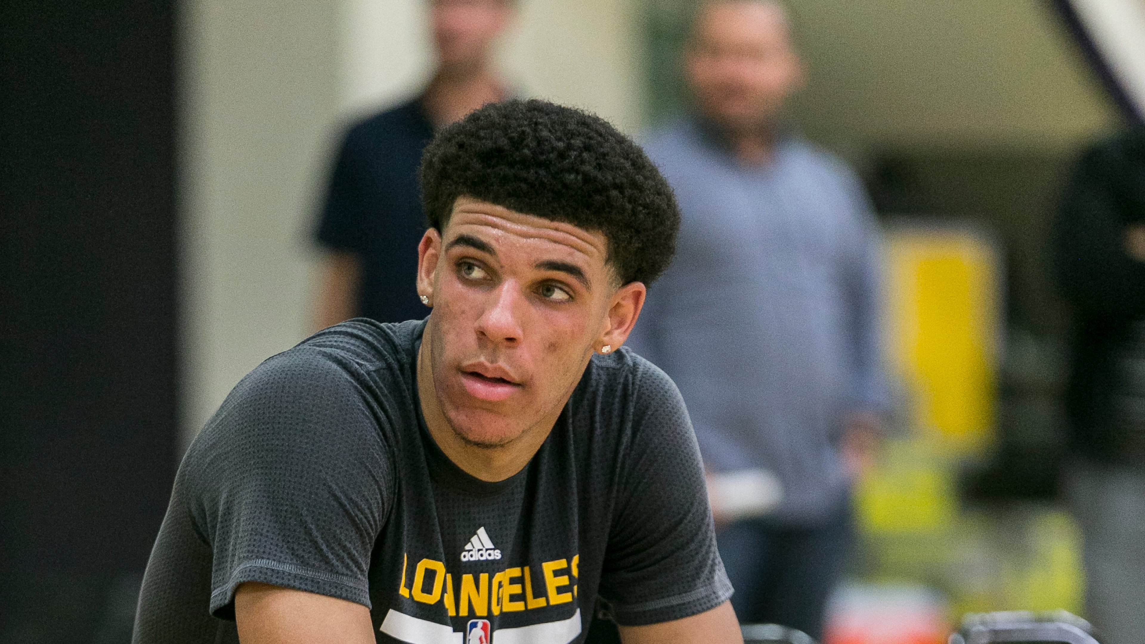 In this June 7, 2017, file photo, UCLA guard Lonzo Ball relaxes after a closed Los Angeles Lakes pre-draft workout in El Segundo, Calif. Because of his headline-magnet father, Ball’s celebrity has already outpaced his talents before he plays his first professional game. (AP Photo/Damian Dovarganes, File)