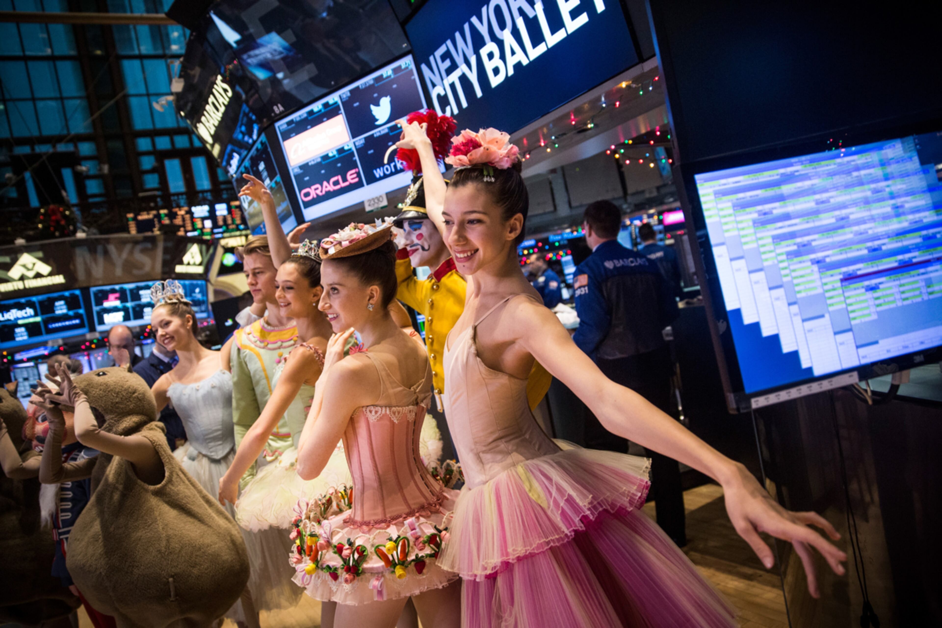 CRACKING THE MARKET--NEW YORK, NY - DECEMBER 24: New York City Ballet dancers from this year's production of The Nutcracker visit the floor of the New York Stock Exchange on the morning of December 24, 2014 in New York City. The market opened above 18,000 points for the first time in its history this morning. (Photo by Andrew Burton/Getty Images) *** BESTPIX ***