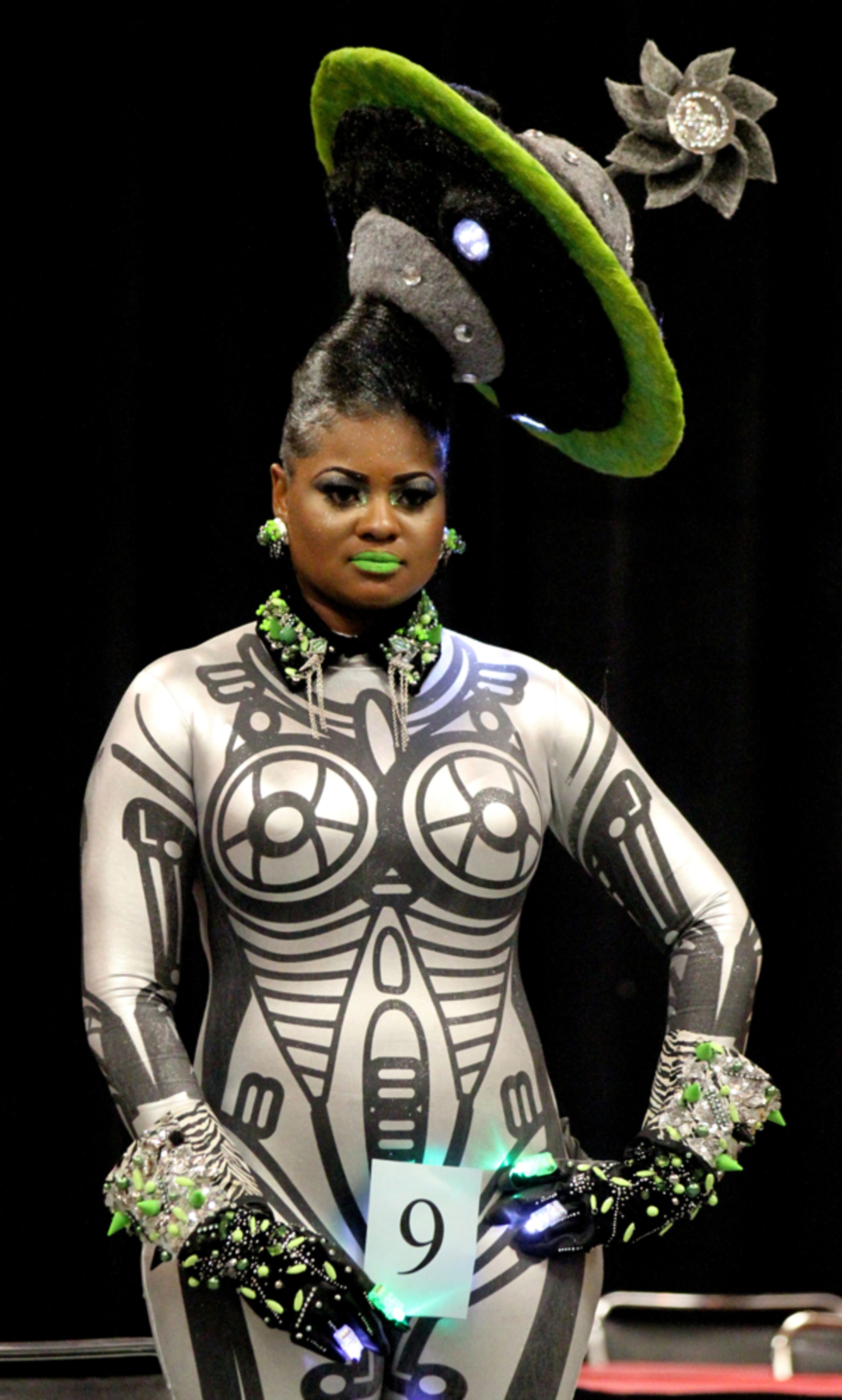 DOES THIS HAT MAKE MY HEAD LOOK BIG?--FEBRUARY 16, 2013-ATLANTA:Amber Sanders models a "Glambot" theme by Kristina Beaty during the Bronner Bros. International Hair & Beauty Mid-Winter 2013 Show Fantasy Competition at the Georgia World Congress Center in Atlanta in Saturday Feb. 16th, 2013. Professional stylists compete for a total look and beauty as creative as they can be. The stylists and model can works as a team with no other outside help in the competition area. The show is billed as one of the largest beauty & trade shows of its kind in the world. PHIL SKINNER / PSKINNER@AJC.COM