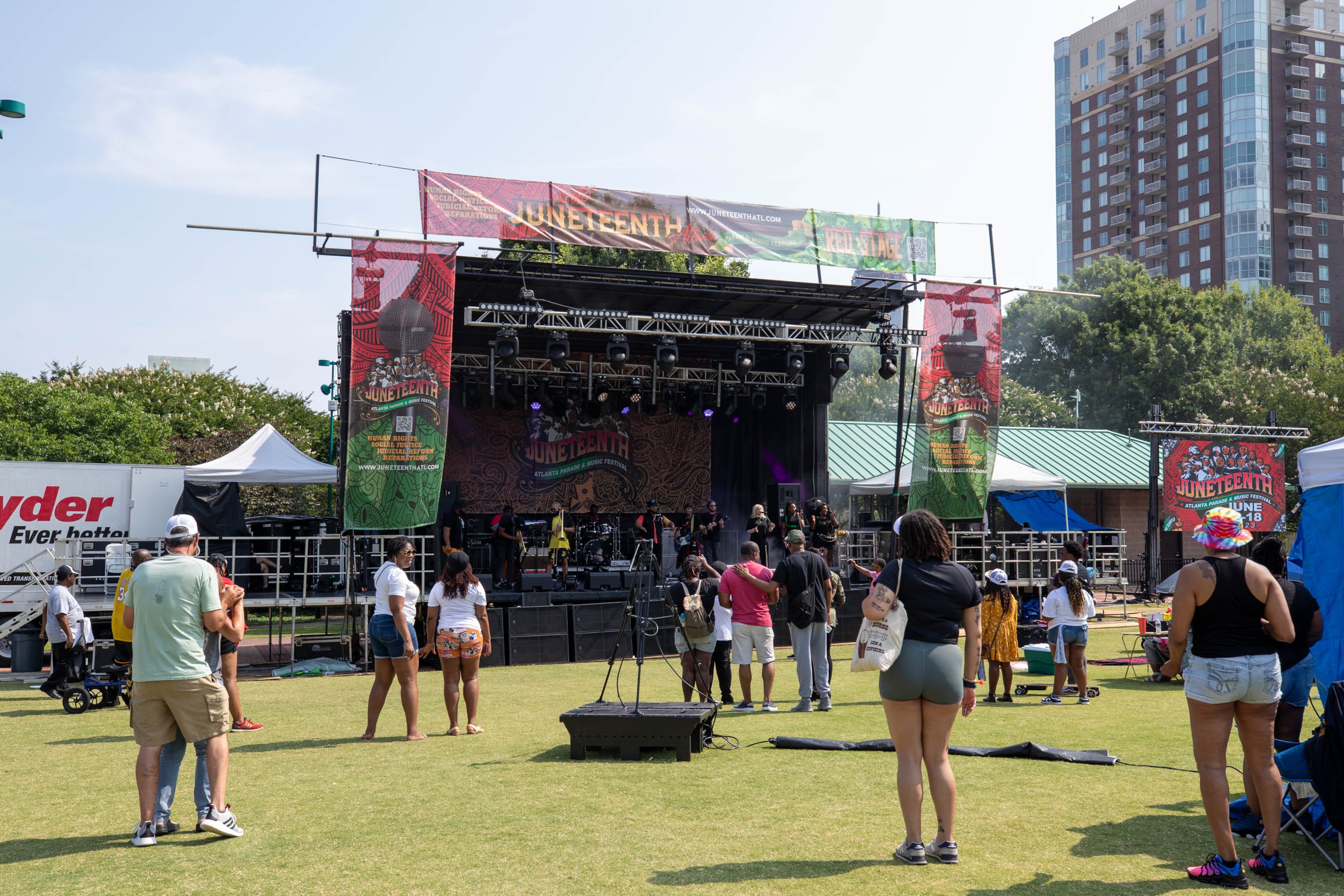 People observe and listen to music at the Juneteenth Parade and Music Festival in Atlanta on Saturday, June 17, 2023. (Katelyn Myrick/katelyn.myrick@ajc.com)