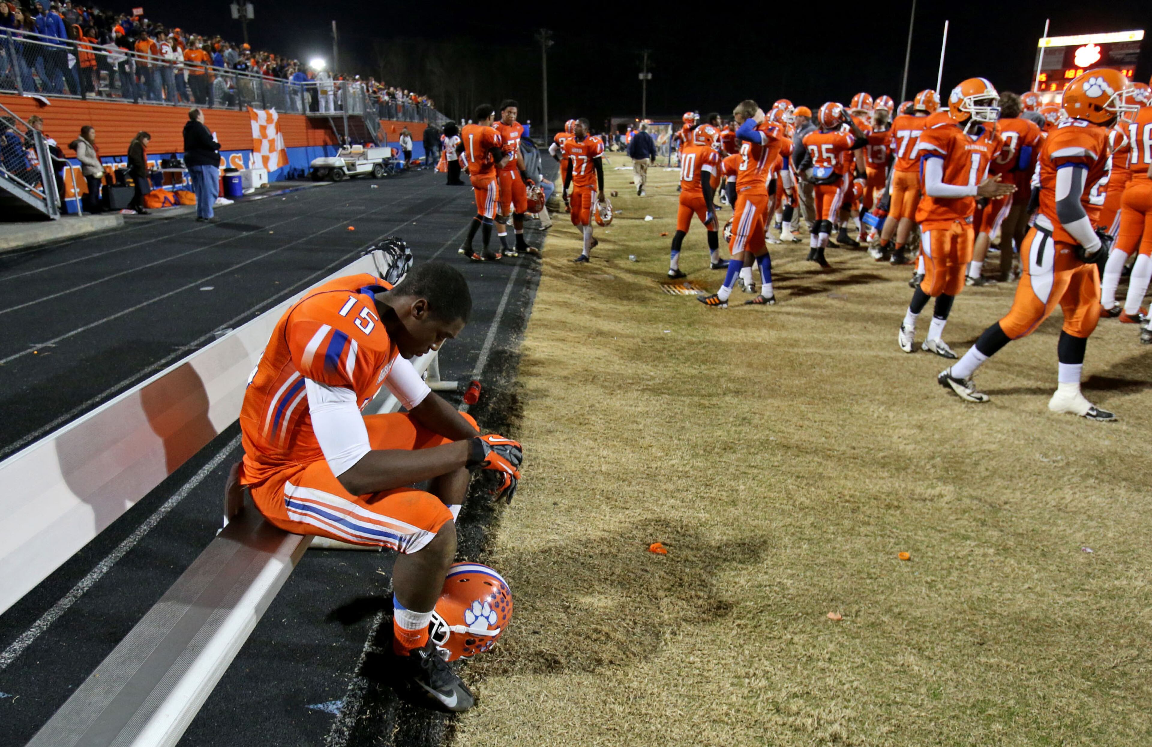Parkview senior wide receiver / defensive lineman Larry Veal (15) reacts on a bench as time expires during Parkview's 31-15 loss to Colquitt County in the Class AAAAAA quarter-final game at Parkview High School Friday night in Lilburn, Ga., November 30, 2012. JASON GETZ / JGETZ@AJC.COM