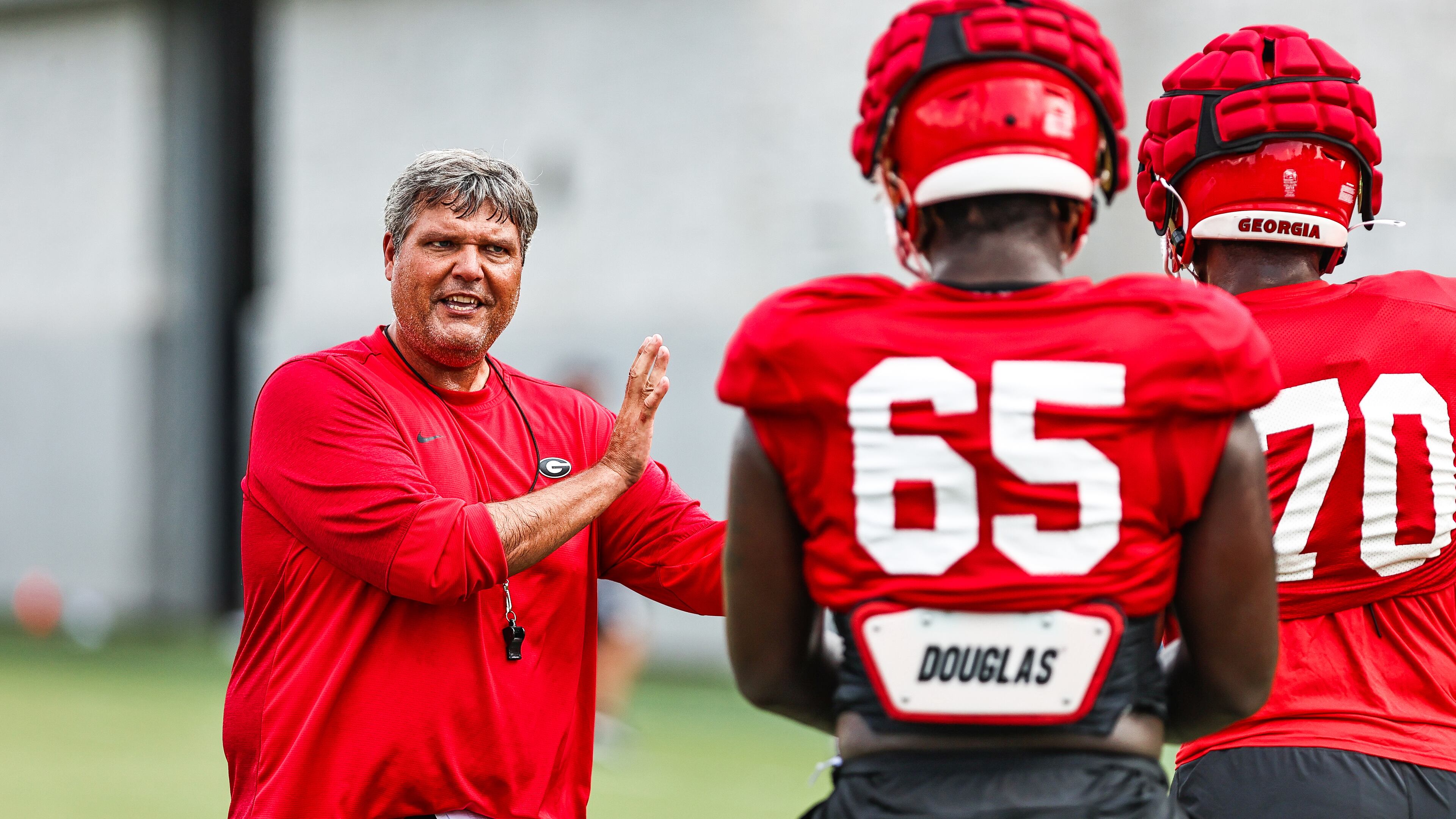 Georgia offensive line coach Matt Luke gives players direction during the Bulldogs’ practice Tuesday, Aug. 24, 2021, in Athens. (Tony Walsh/UGA)