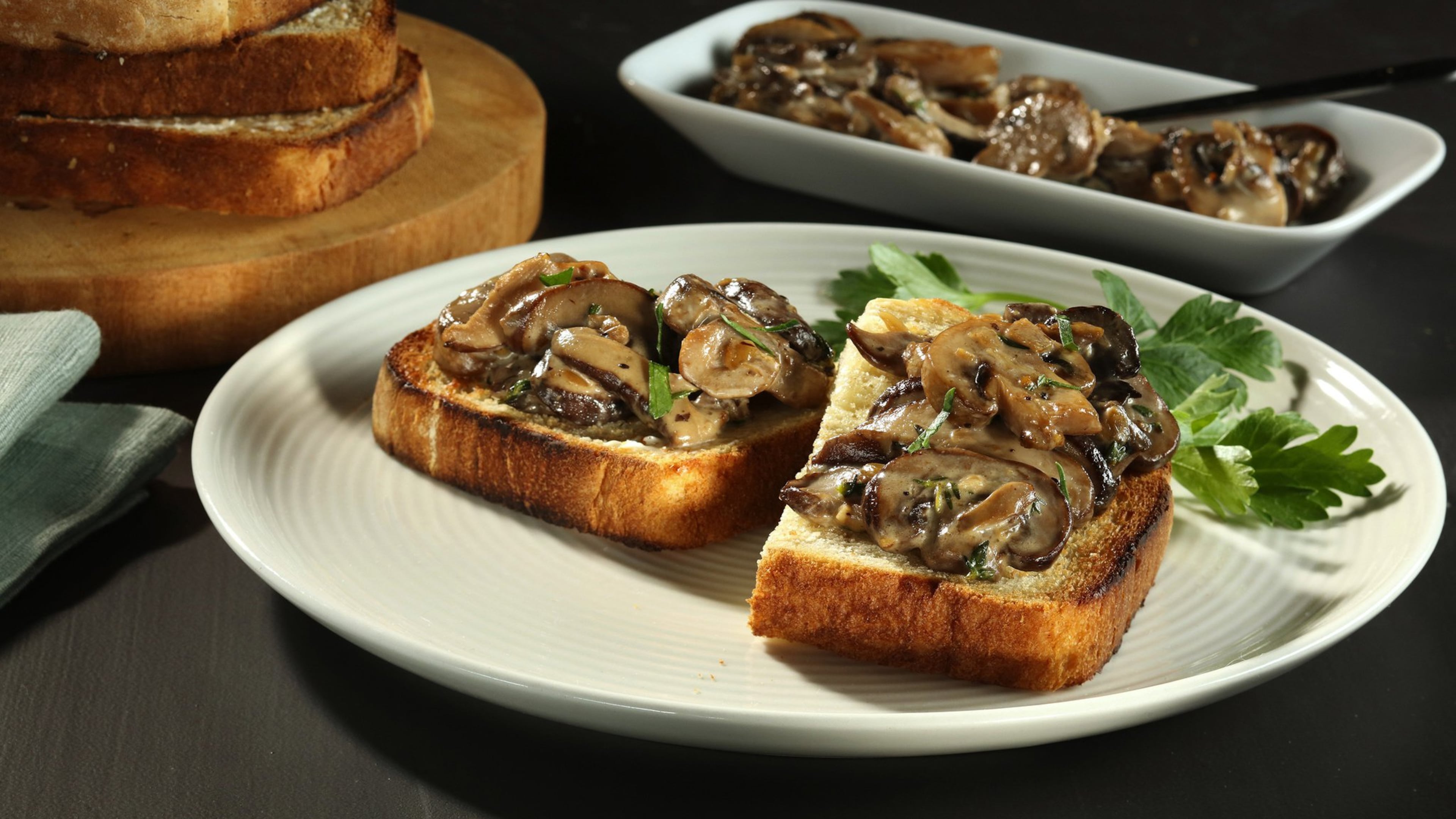 A mix of mushrooms is sauteed with shallots then flavored with sherry and cream to make a rich topping for toast. (Joan Moravek/food styling) (Chris Walker/Chicago Tribune/TNS)