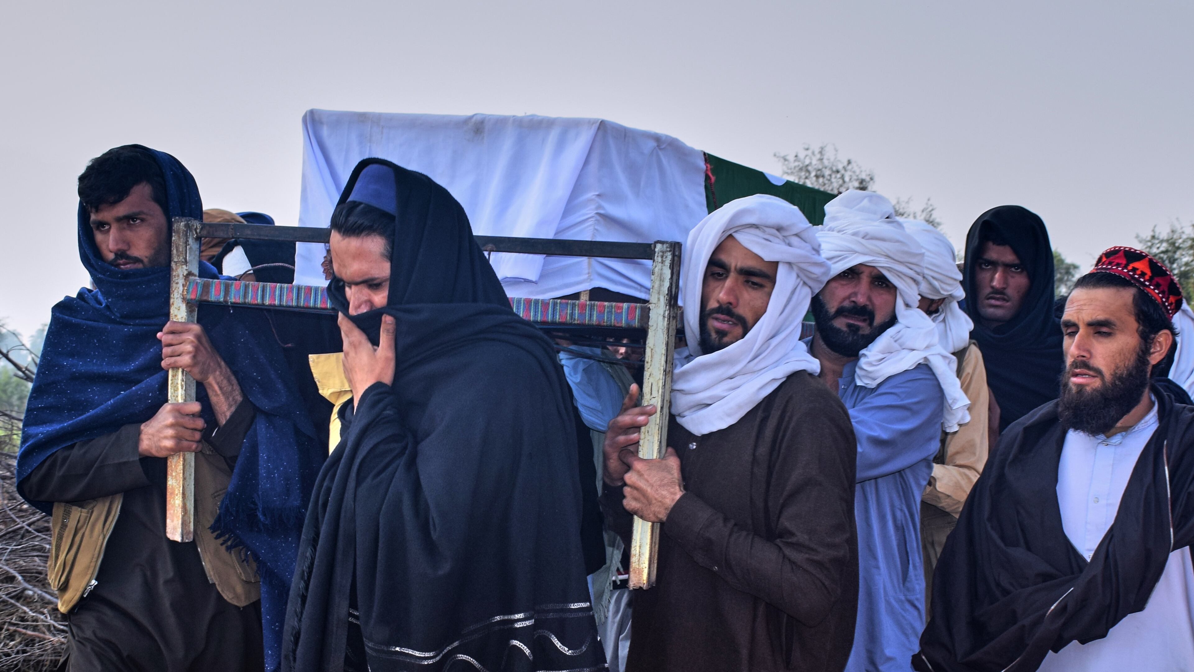 People carry the coffin of an army soldier, killed in the cross-border clashes of Pakistan and Afghan forces, for his funeral prayer at a village in Lakki Marwat, a district of Pakistan's Khyber Pakhtunkhwa province, Saturday, Feb. 28, 2026. (AP Photo/G.A. Marwat)
