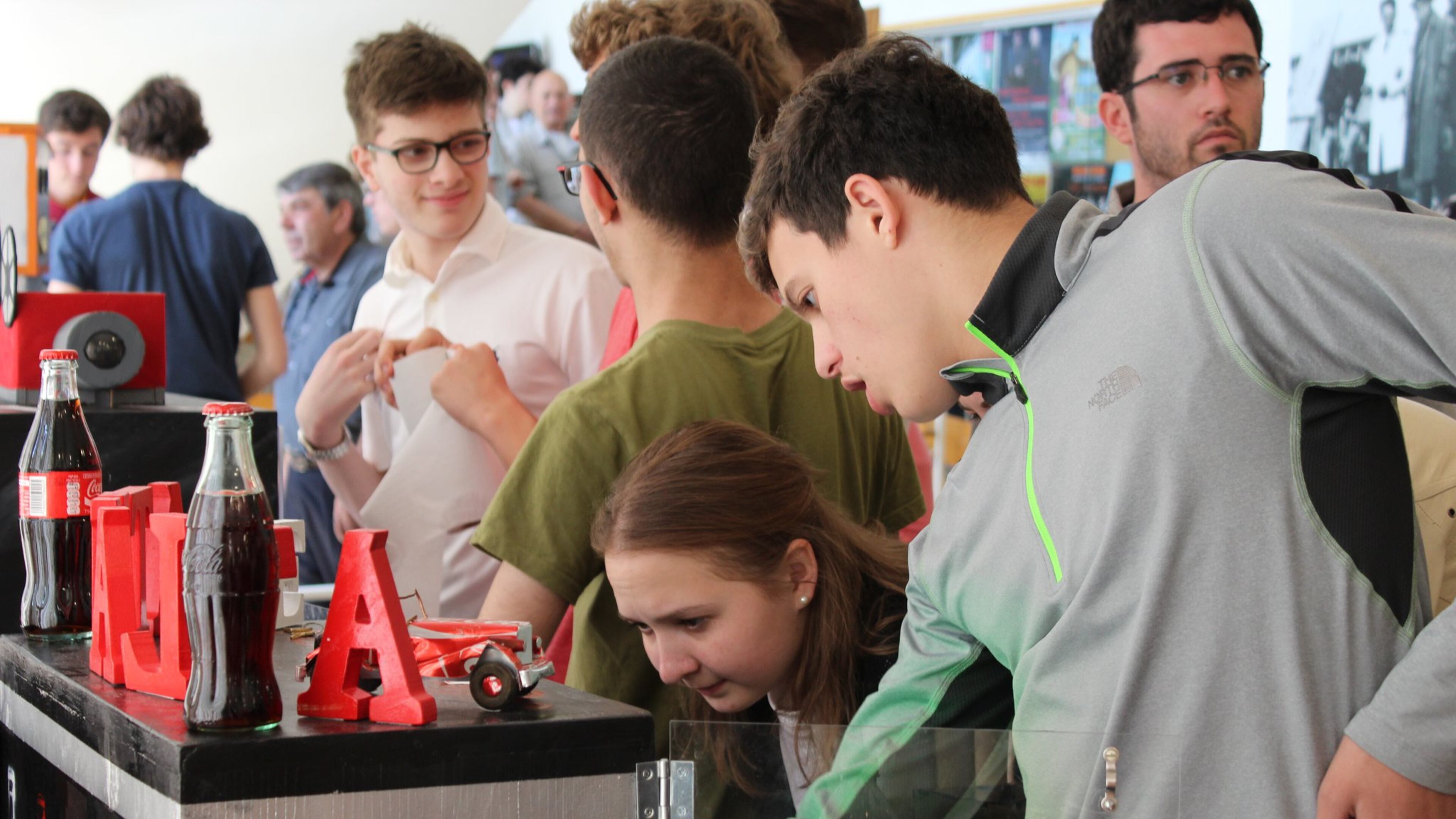 Eric Lieberman (right) explains the working system behind the a “safe” he and teammates from The Weber School built and entered in the Weizmann Institute’s International Safe-Cracking tournament, held in Israel in February.
