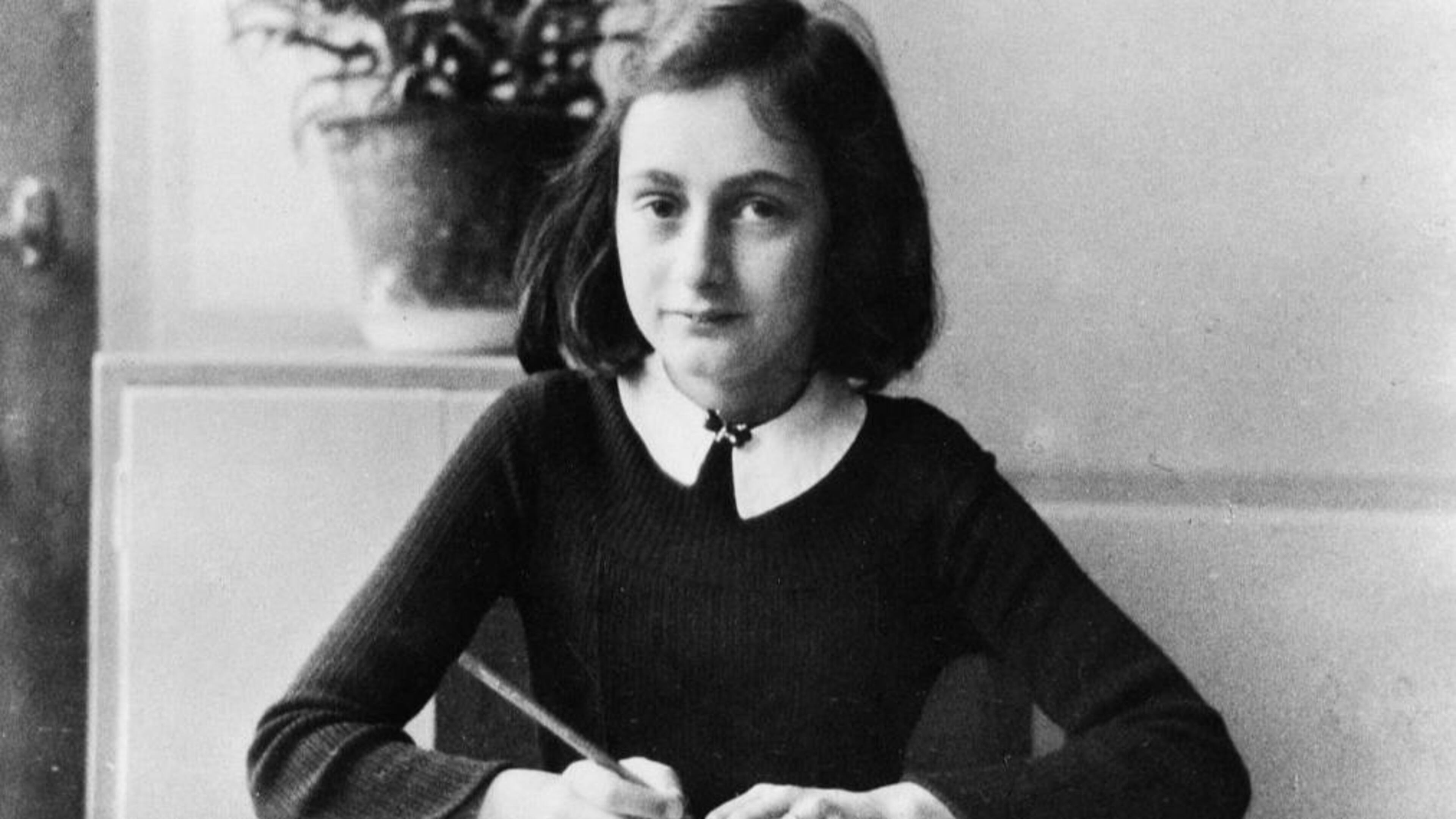 Anne Frank, German Jew who emigrated with her family to the Netherlands during the Nazi era. Separated from the rest of her family, she and her sister died of typhoid fever in the concentration camp Bergen-Belsen - As a 12-year old doing her homework - 1941 (Photo by ADN-Bildarchiv/ullstein bild via Getty Images)