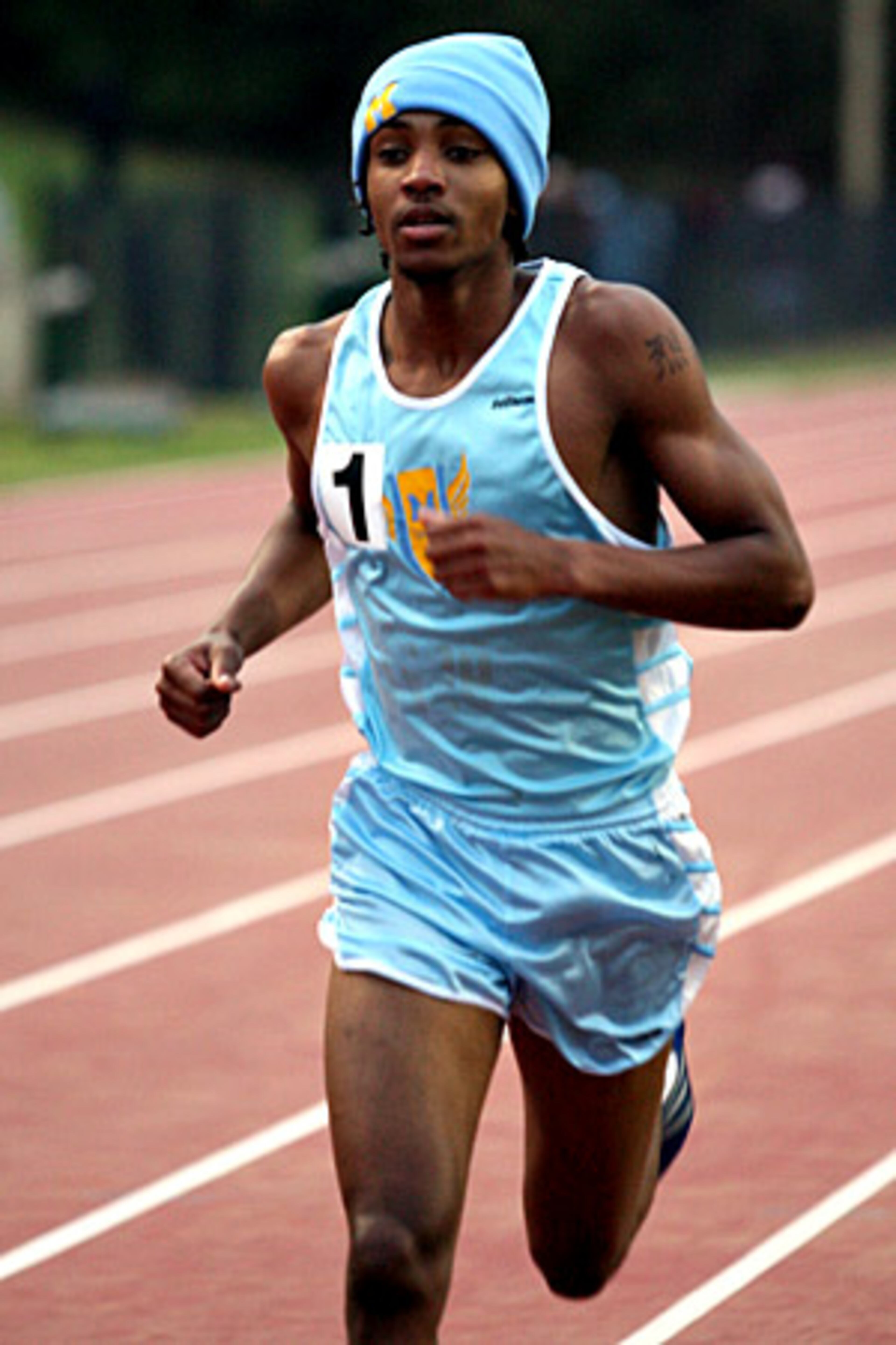 Mays' Raymond Walston cruises to a first place finish in the Boys' 3200 Meters distance run.