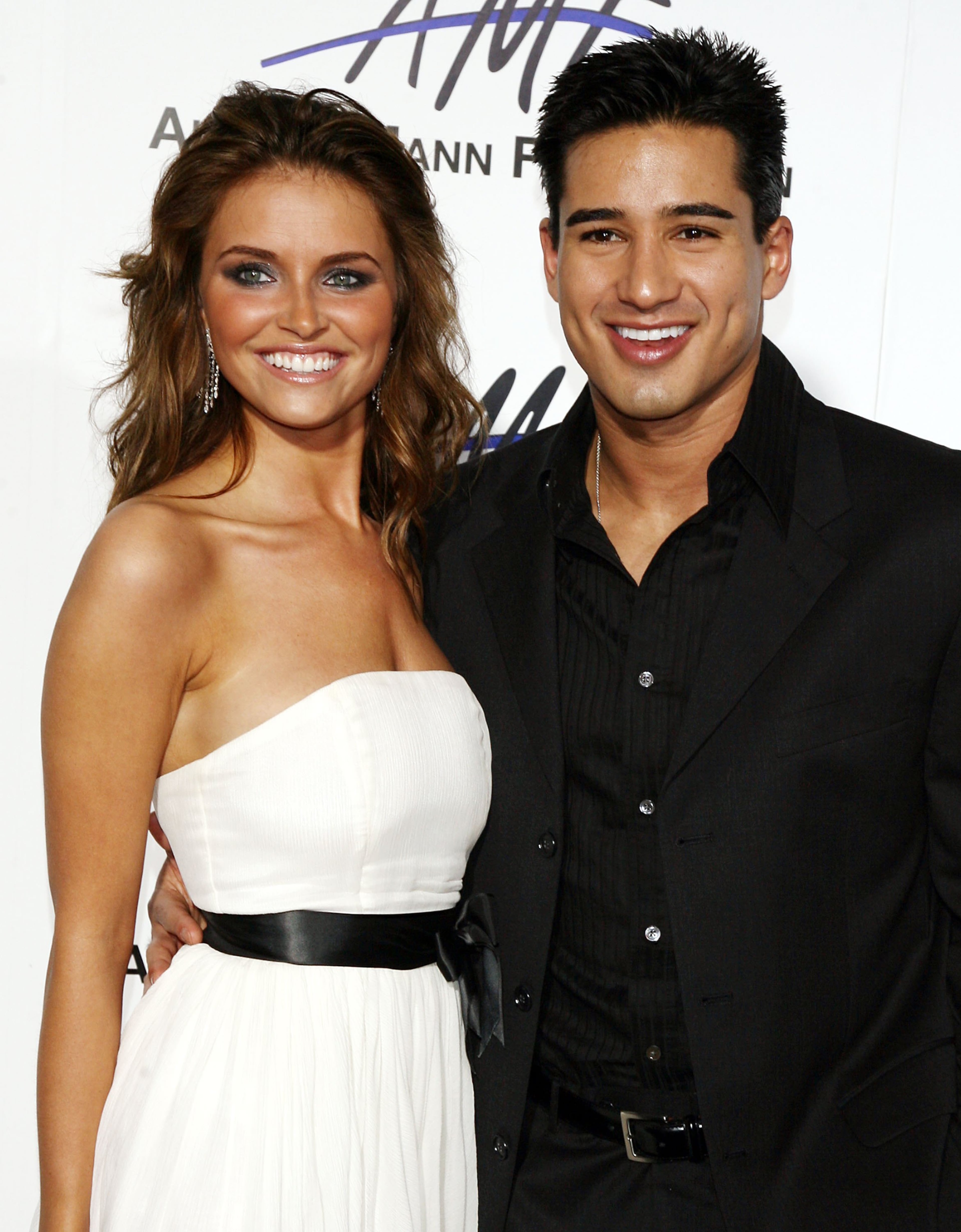 Actors Heidi Mueller (left) and Mario Lopez arrive at the third annual Alfred Mann Foundation Innovation & Inspiration Gala at the Mann Estate on Sept. 9, 2006, in Los Angeles.
