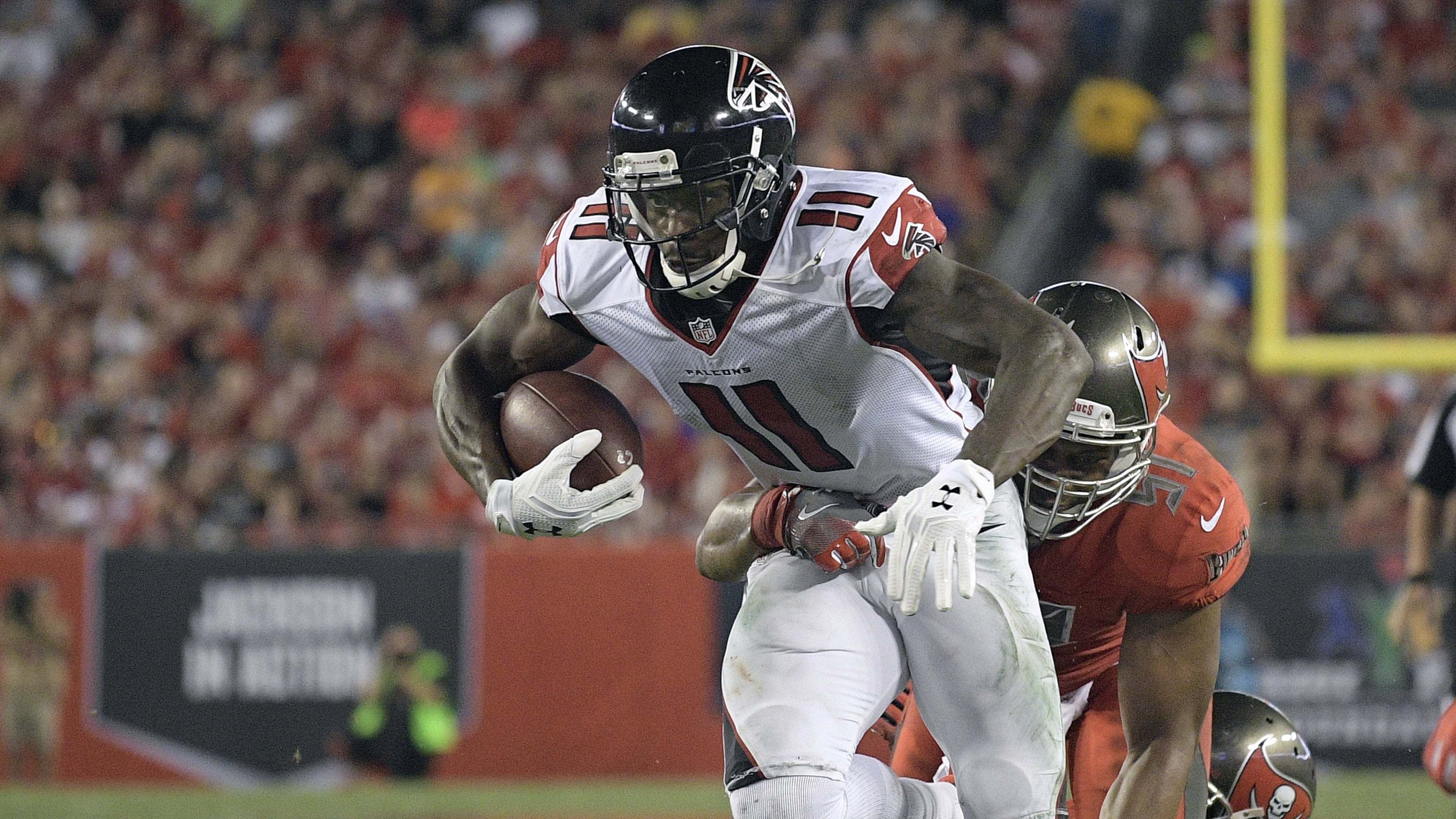 Atlanta Falcons wide receiver Julio Jones (11) slips a tackle by Tampa Bay Buccaneers outside linebacker Daryl Smith (51) during the third quarter of an NFL football game Thursday, Nov. 3, 2016, in Tampa, Fla. (AP Photo/Phelan Ebenhack)