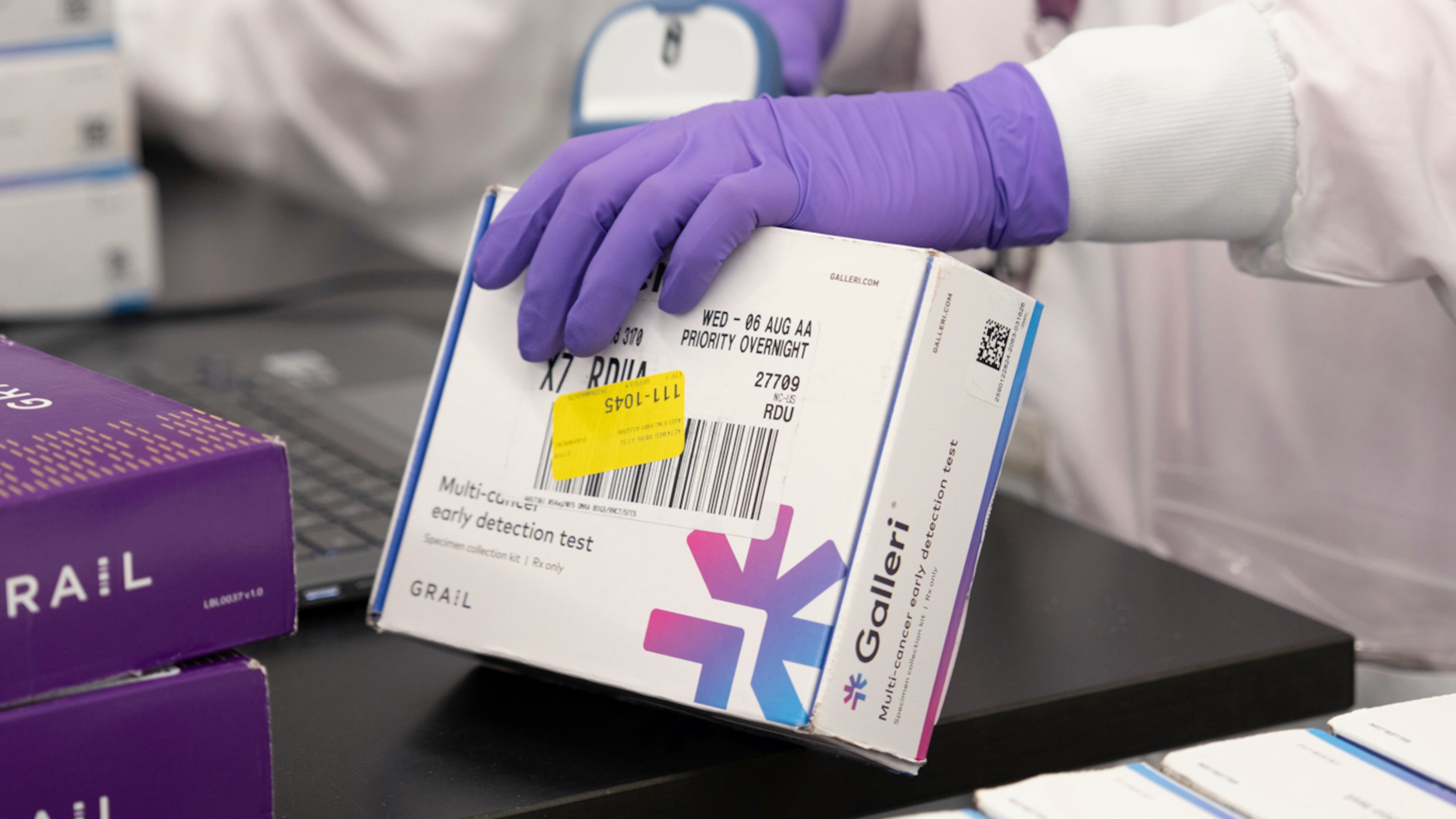This undated photo provided by Grail Inc. on Tuesday, Sept. 22, 2026, shows an employee scanning a Galleri cancer screening test. (Grail Inc. via AP)