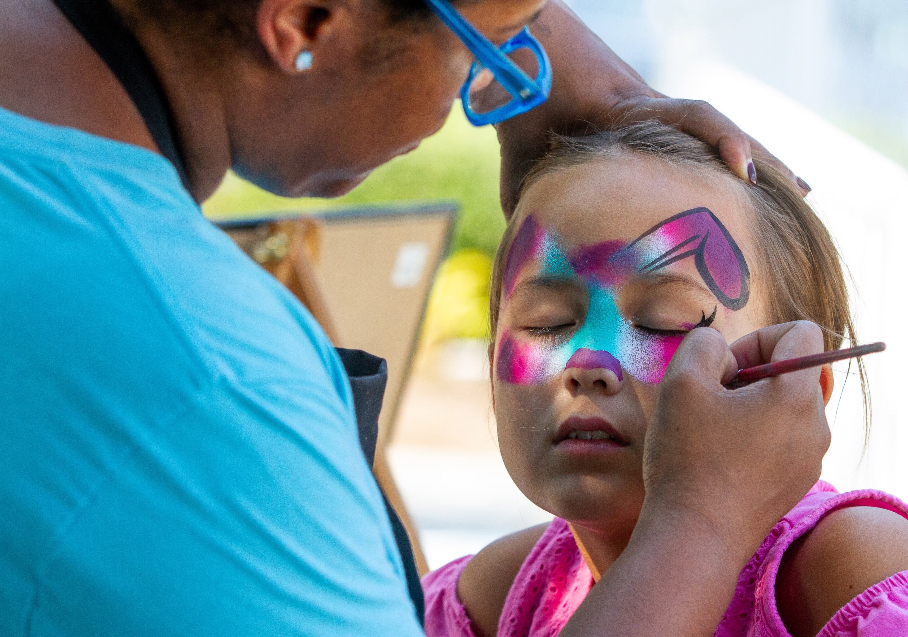 Ella Paciorek gets a rainbow pup painted on her face during the Atlanta Greek Festival at the Greek Orthodox Cathedral of the Annunciation on Sunday, September 29, 2019. STEVE SCHAEFER / SPECIAL TO THE AJC