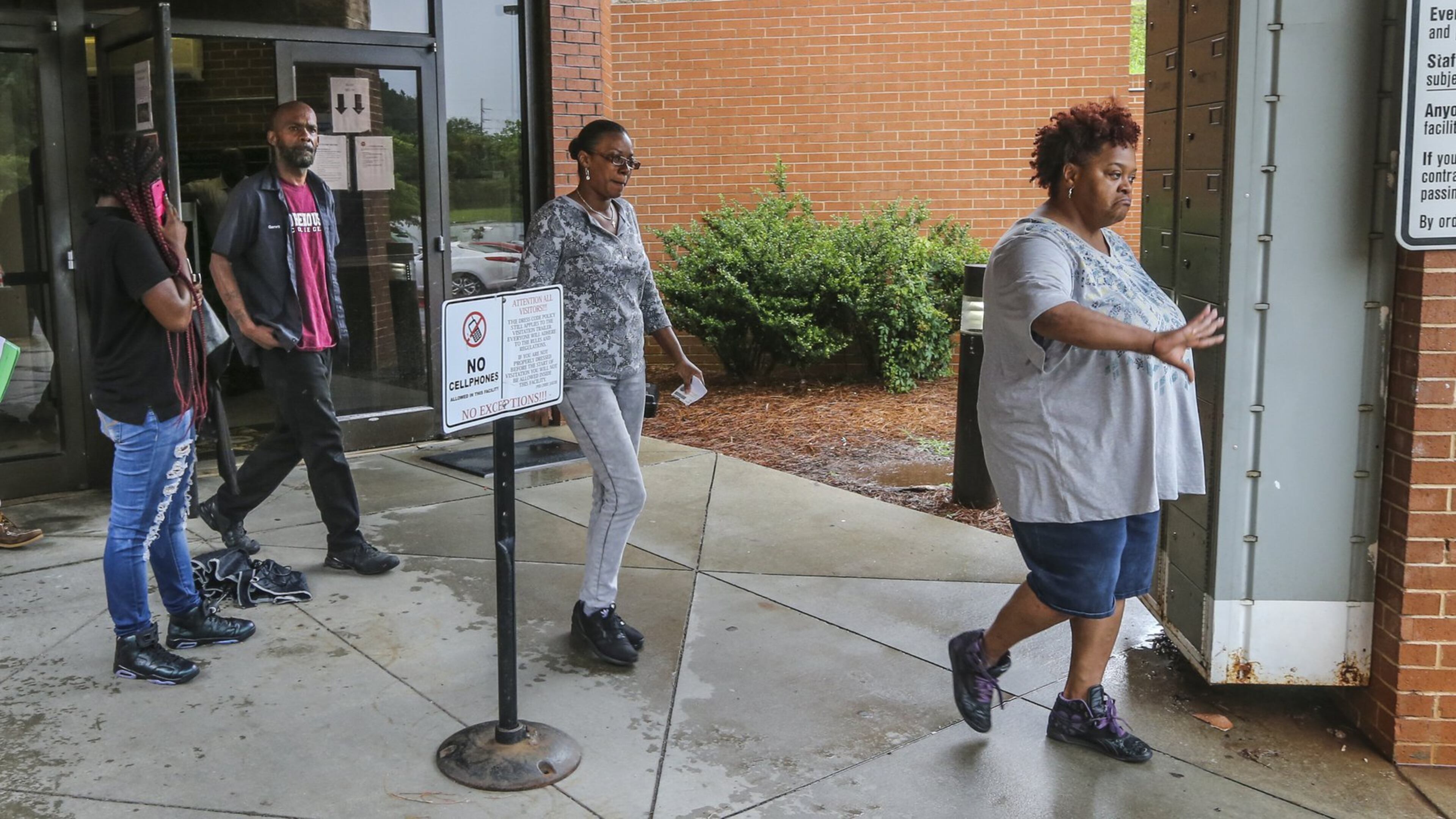 May 30, 2017 Atlanta: Garrett Ingram, the father of Demarco Mosley (left) leaves the Fulton County Jail with family members (right). He voiced frustration he was could not see his son after he waived his first appearance. JOHN SPINK/JSPINK@AJC.COM