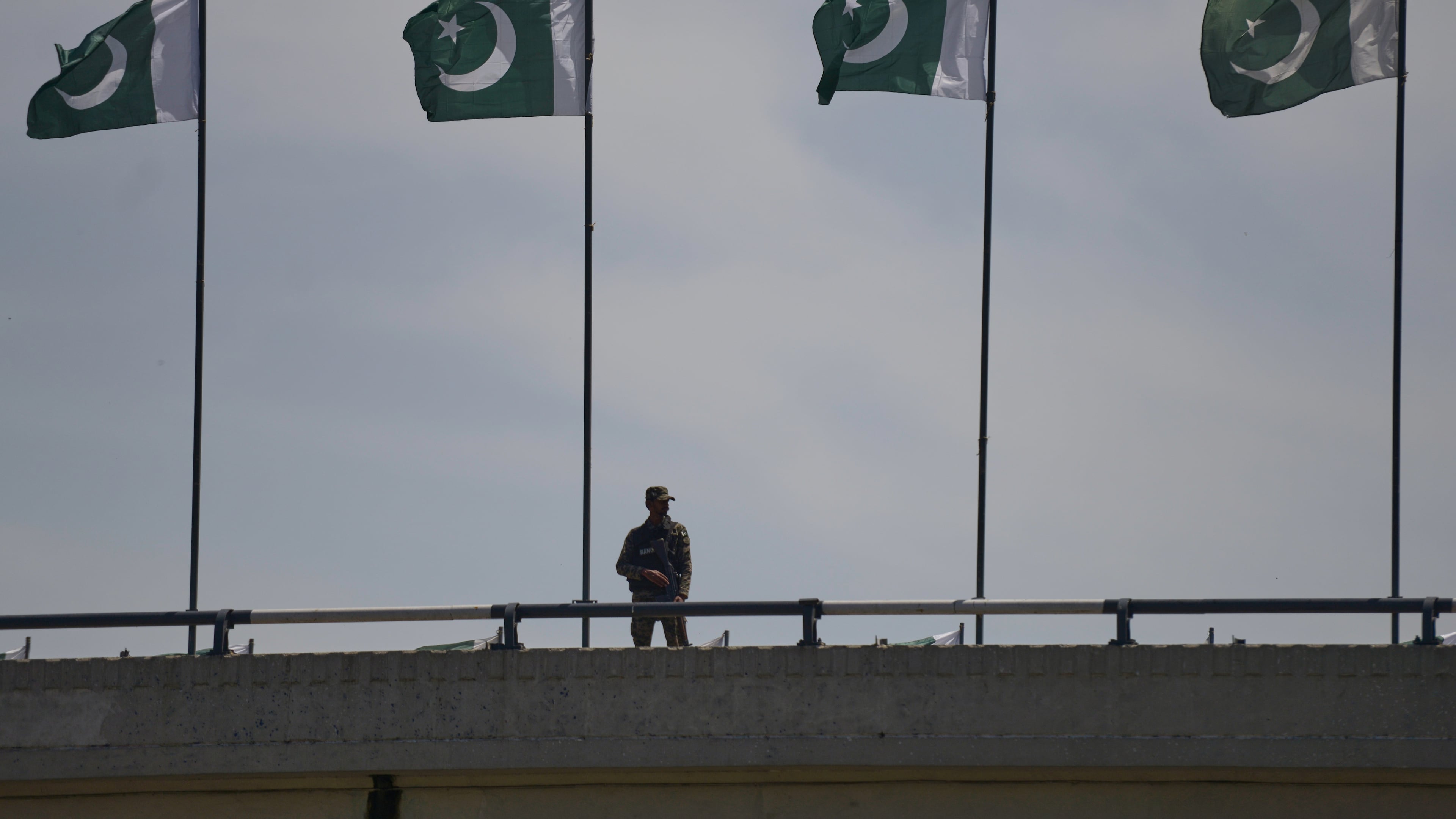 A soldier stands guard on a bridge ahead of second round of negotiations between the U.S. and Iran, in Islamabad, Pakistan, Monday, April 20, 2026. (AP Photo/M.A. Sheikh)