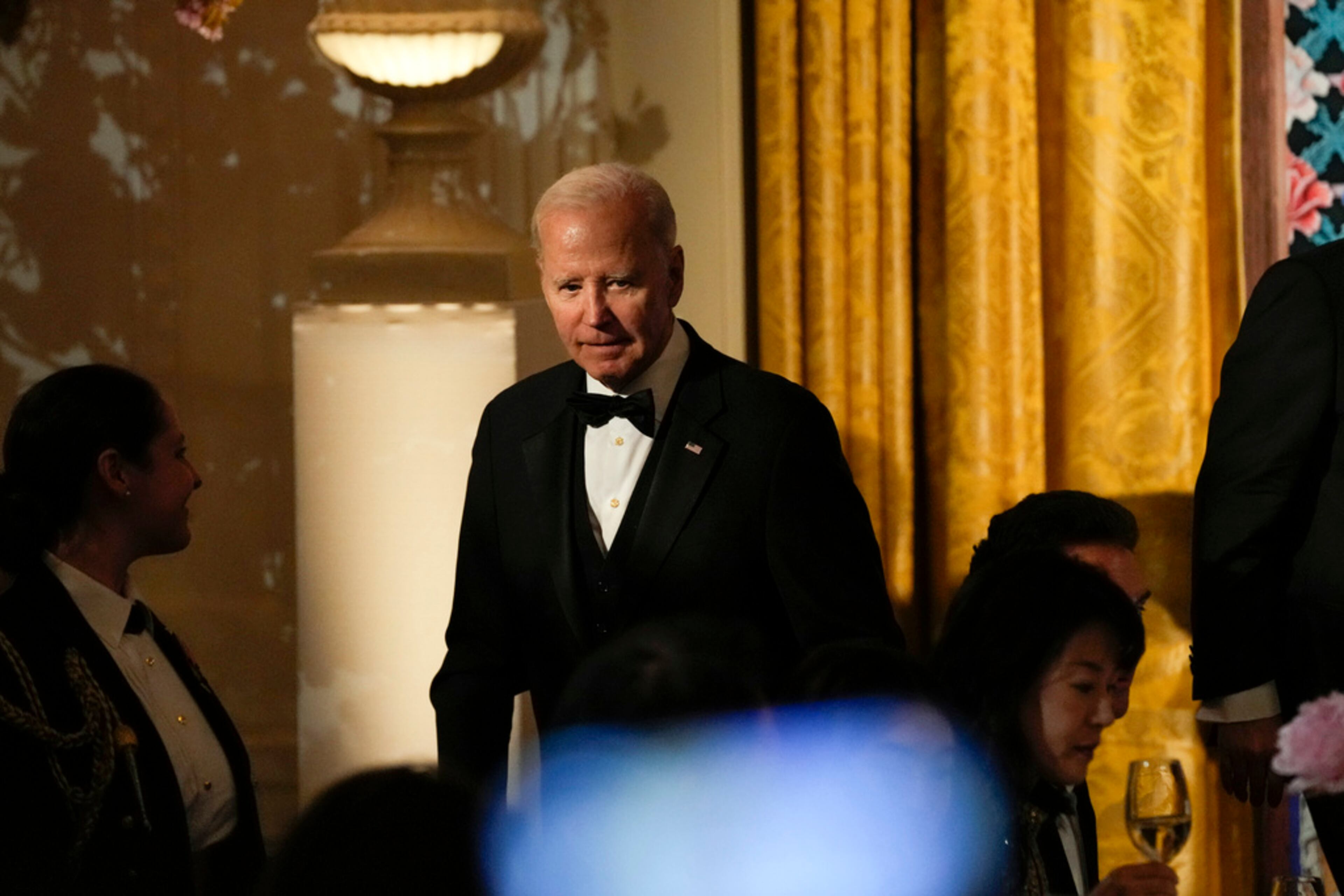 President Joe Biden walks to his table after toasting with South Korea's President Yoon Suk Yeol during a State Dinner in the East Room of the White House in Washington, Wednesday, April 26, 2023. (AP Photo/Susan Walsh)