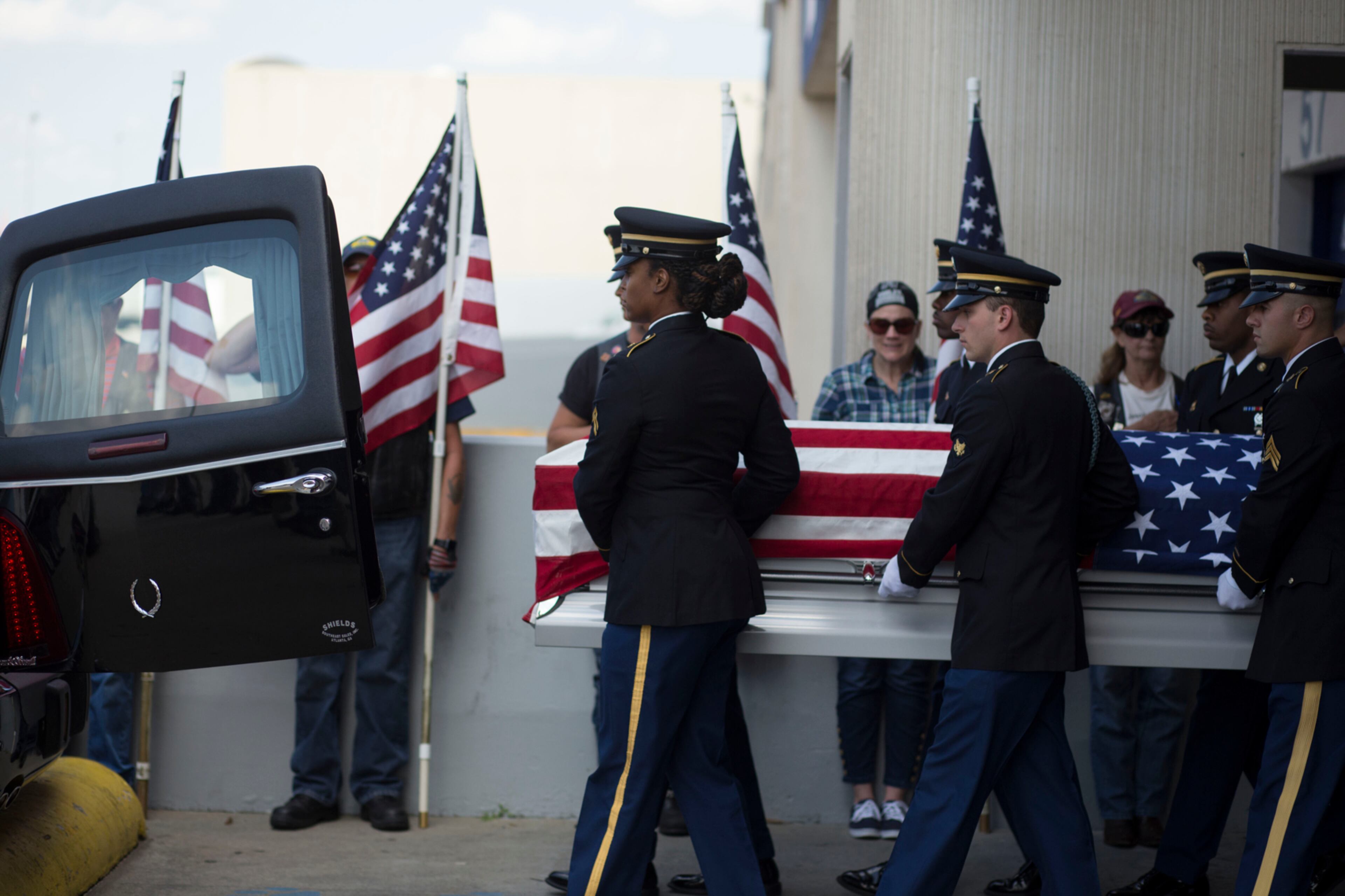 Lieutenant Robert Eugene Oxford, age 24, of Concord, died Jan. 25, 1944, when his plane crashed during a cargo flight over the Himalayan Mountains. His remains were discovered last year and he was recently identified. His remains return home Thursday. Members of the military carry Oxford's casket into the hearse at Hartsfield-Jackson International Airport. Chad Rhym/ chad.rhym@ajc.com