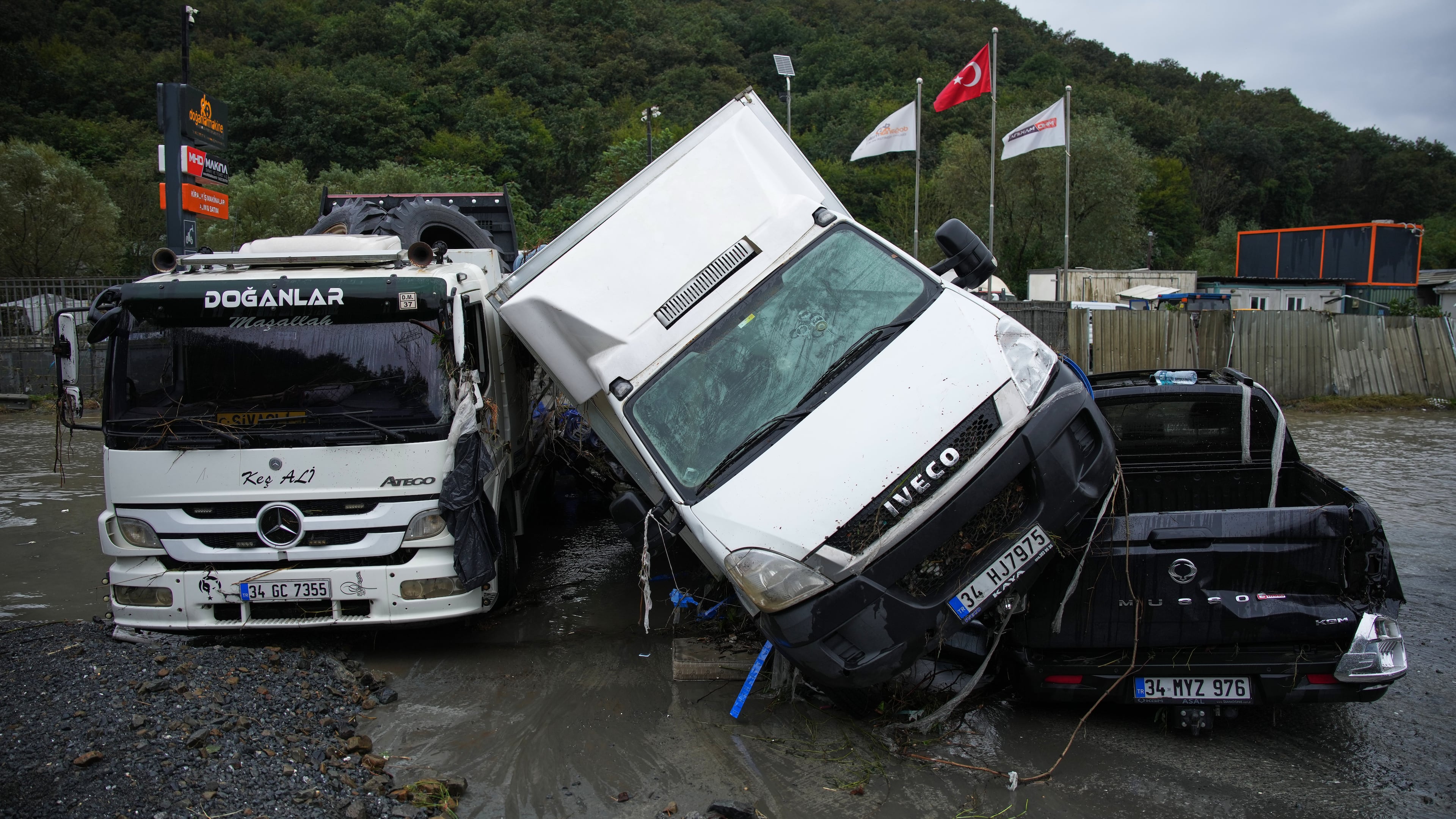 Vehicles lie scattered in the aftermath of flooding caused by heavy rains in Istanbul, Turkey, Thursday, Oct. 15, 2026. (AP Photo/Emrah Gurel)