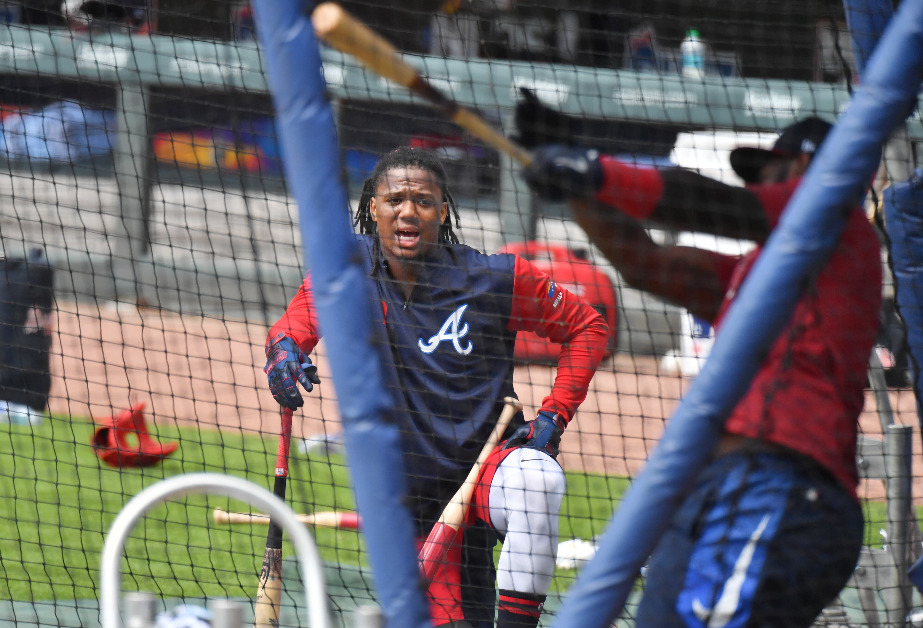 Ronald Acuna Jr. watches Marcell Ozuna takes battle practice. (Hyosub Shin / Hyosub.Shin@ajc.com)