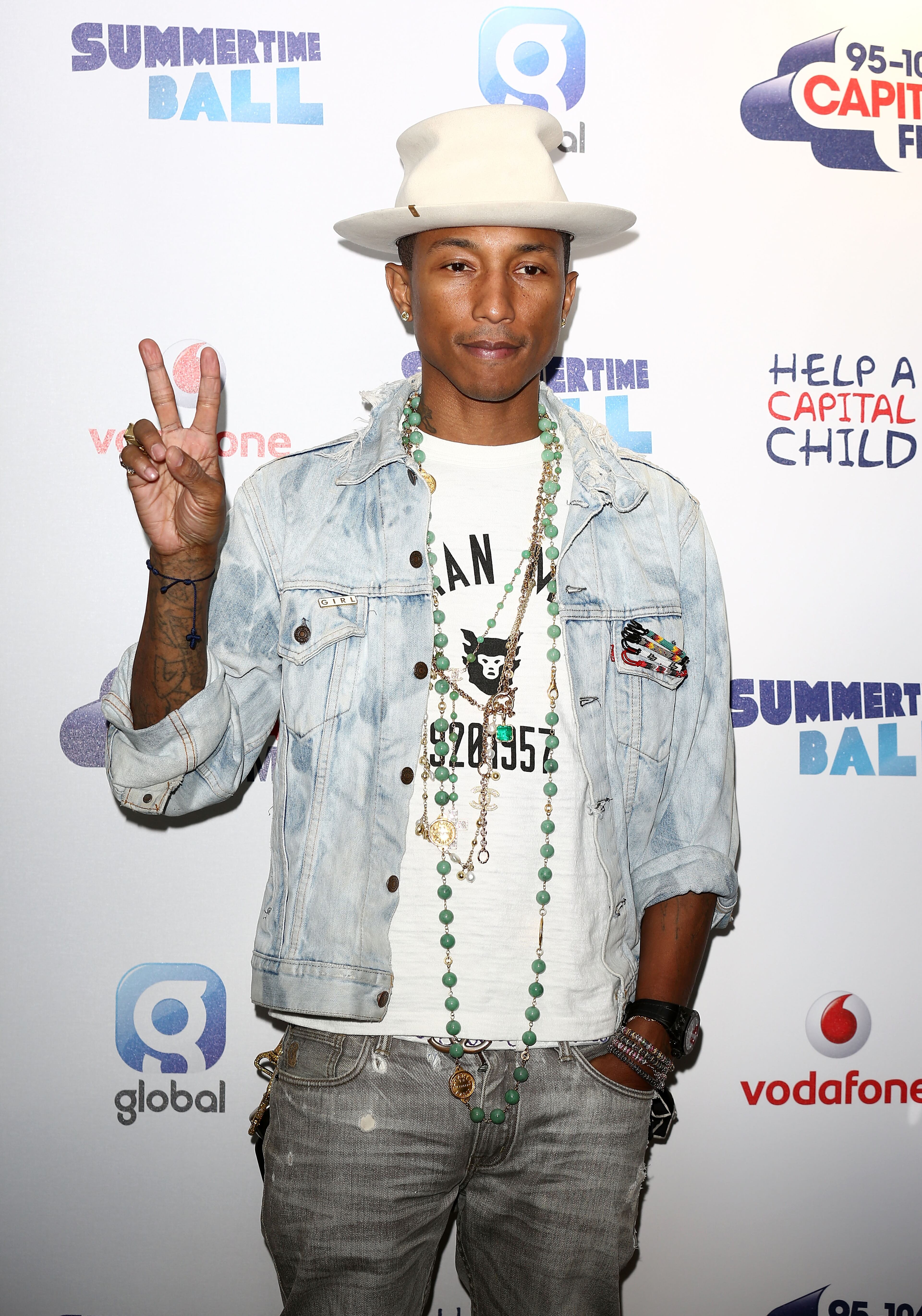 "Happy" singer Pharrell apologized after wearing a Native American headdress on the cover on the cover of Elle magazine. ""I respect and honor every kind of race, background and culture. I am genuinely sorry," he said.