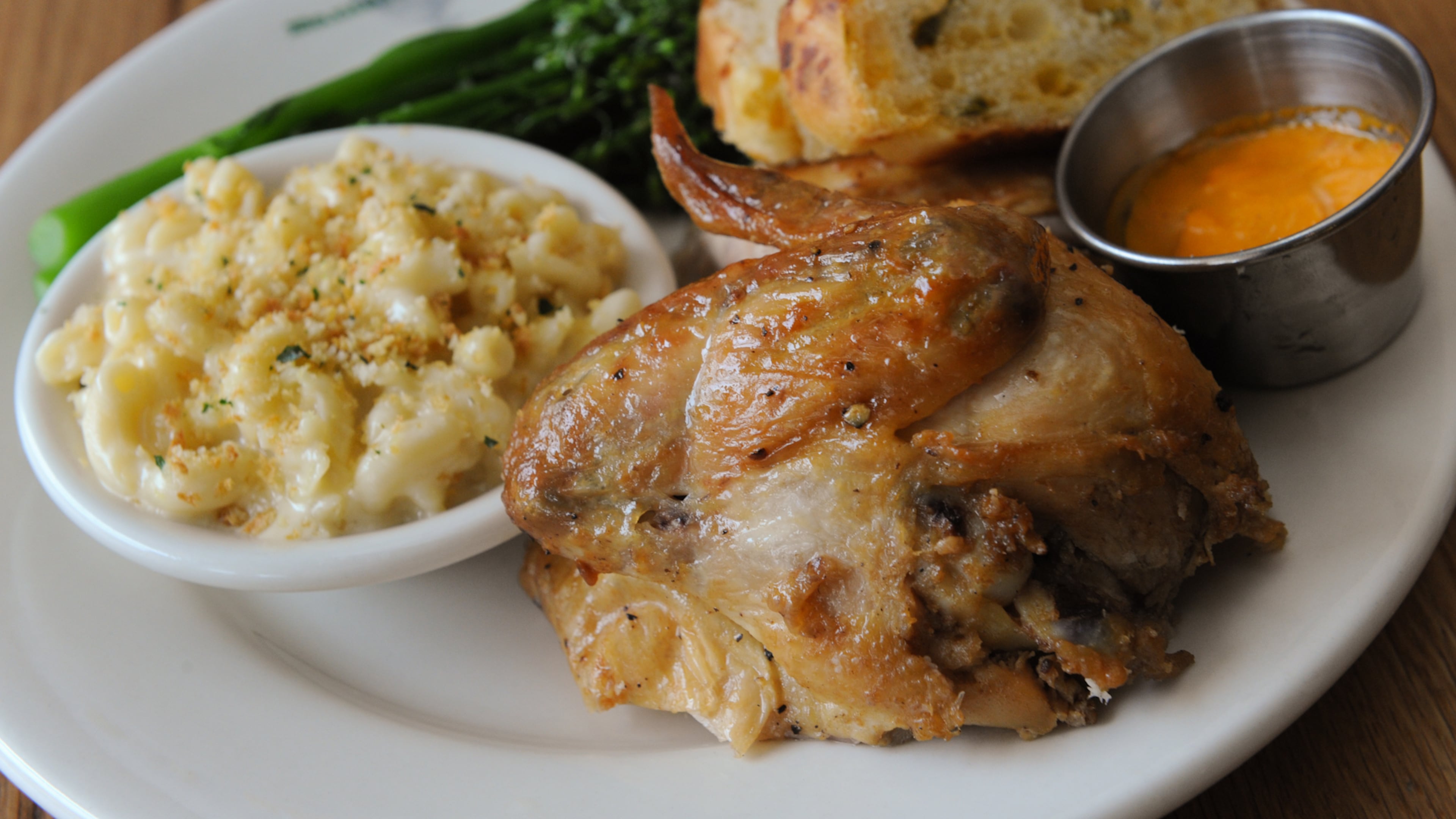 1/4 Carolina Chicken with sauteed broccolini and garlic, aged cheddar mac & cheese and jalapeno cheddar bread at Bantam & Biddy. (Contributed by Becky Stein)