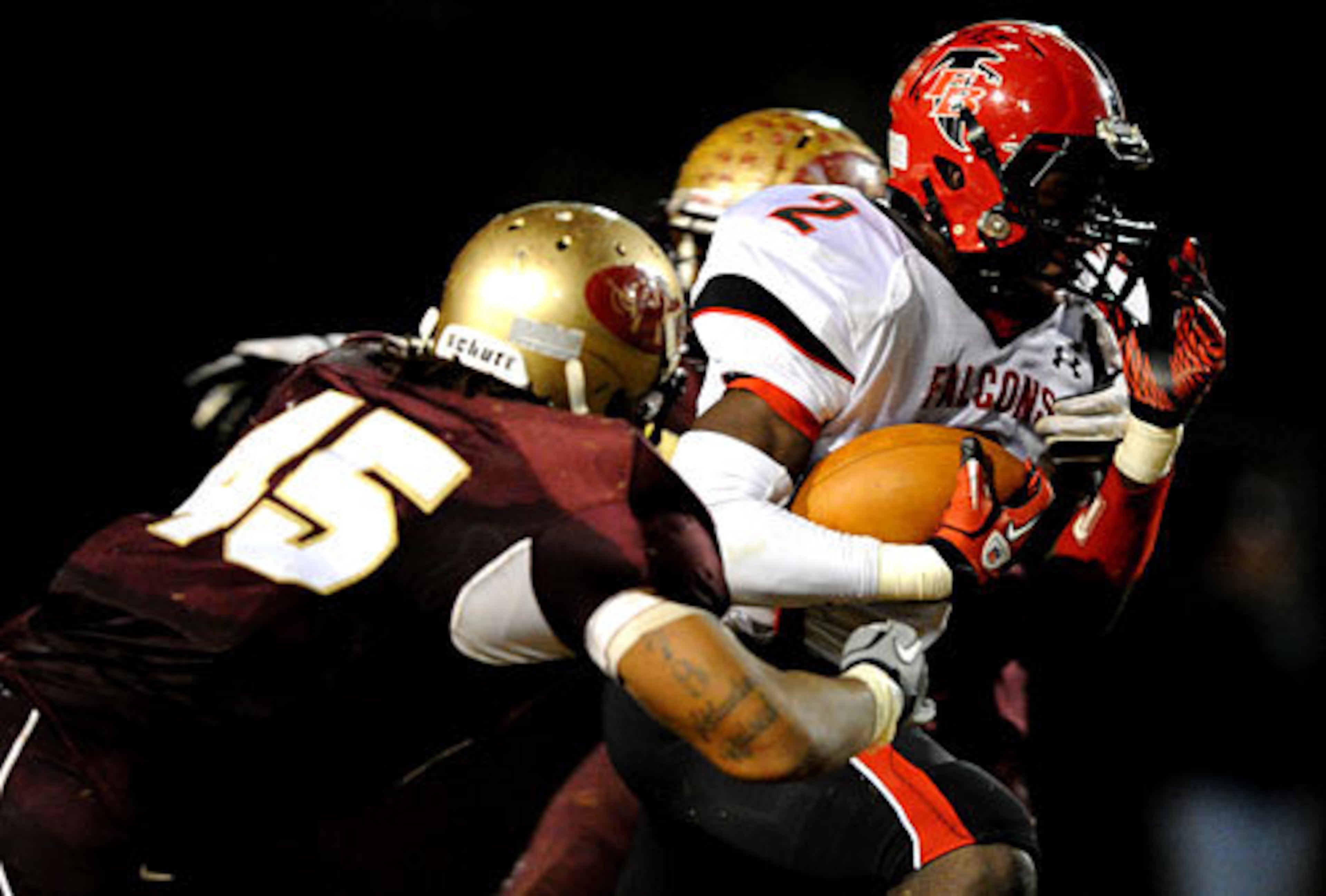 Flowery Branch's Darius Curry (2) is tackled by Tucker's Joseph Rush.