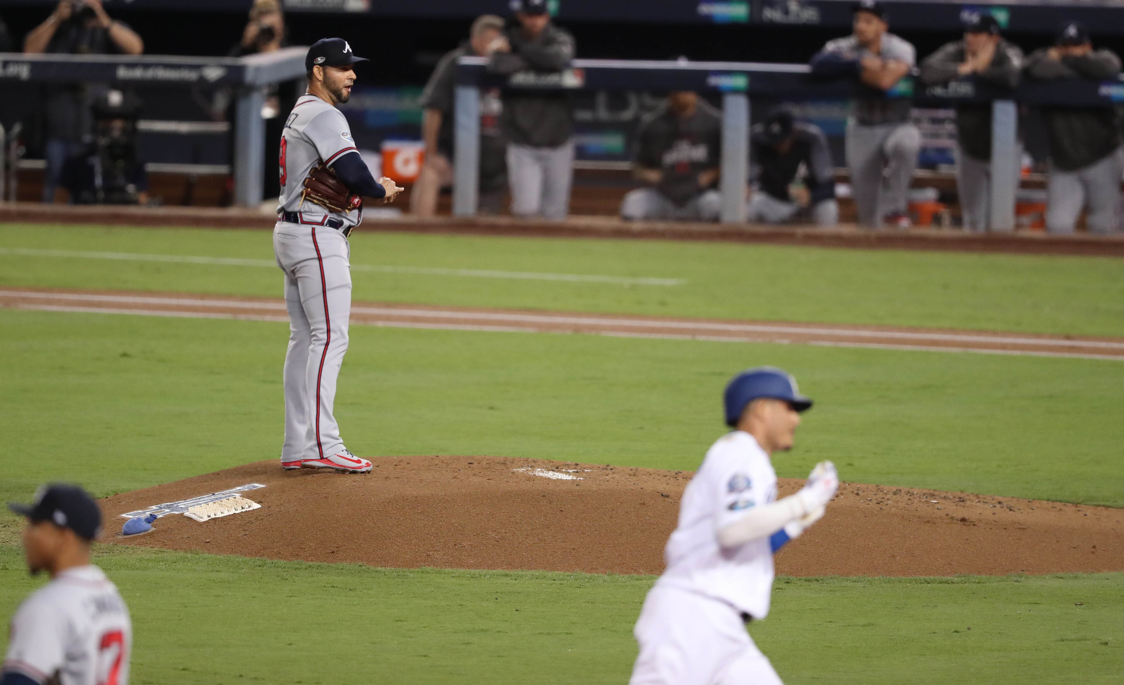 October 5, 2018 - Los Angeles: Atlanta Braves starting pitcher Anibal Sanchez reacts as Los Angeles Dodgers shortstop Manny Machado, bottom right, heads to home after Machado hit a two-run home run in the first inning in Game 2 of a National League Division Series baseball game Friday, October 5, 2018, in Los Angeles. (JASON GETZ/SPECIAL TO THE AJC)