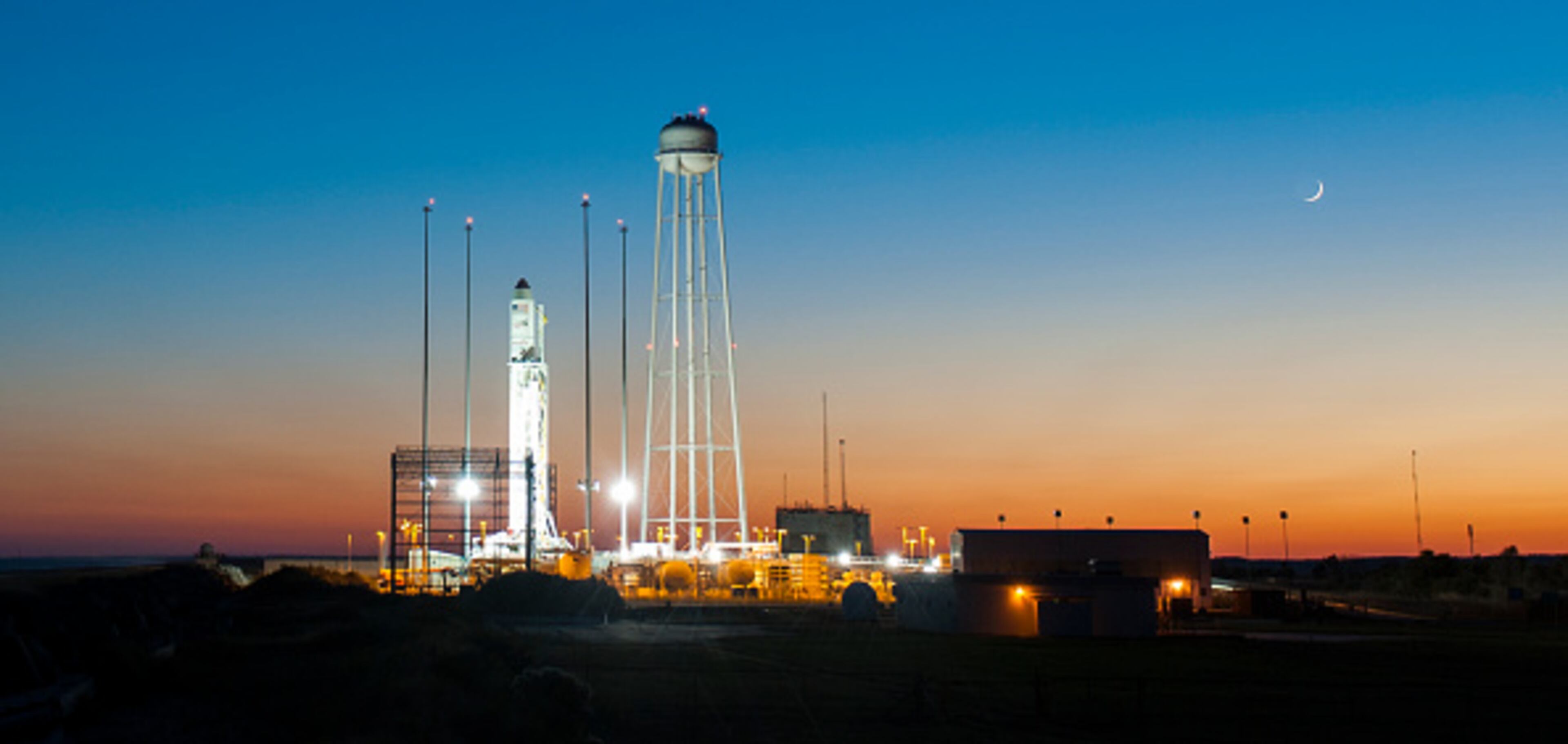 WALLOPS ISLAND, VA - OCTOBER 25: In this handout from NASA, the Orbital Sciences Corporation Antares rocket, with the Cygnus spacecraft onboard, sits on launch Pad-0A, October 25, 2014, at NASA's Wallops Flight Facility, Wallops Island, Virginia. The Antares will launch with the Cygnus filled with over 5,000 pounds of supplies for the International Space Station (ISS), including science experiments, experiment hardware, spare parts, and crew provisions. The Orbital-3 mission is Orbital Sciences' third contracted cargo delivery flight to the space station for NASA and will launch on October 27, 2014. Photo Credit: (Photo by NASA/Joel Kowsky via Getty Images)