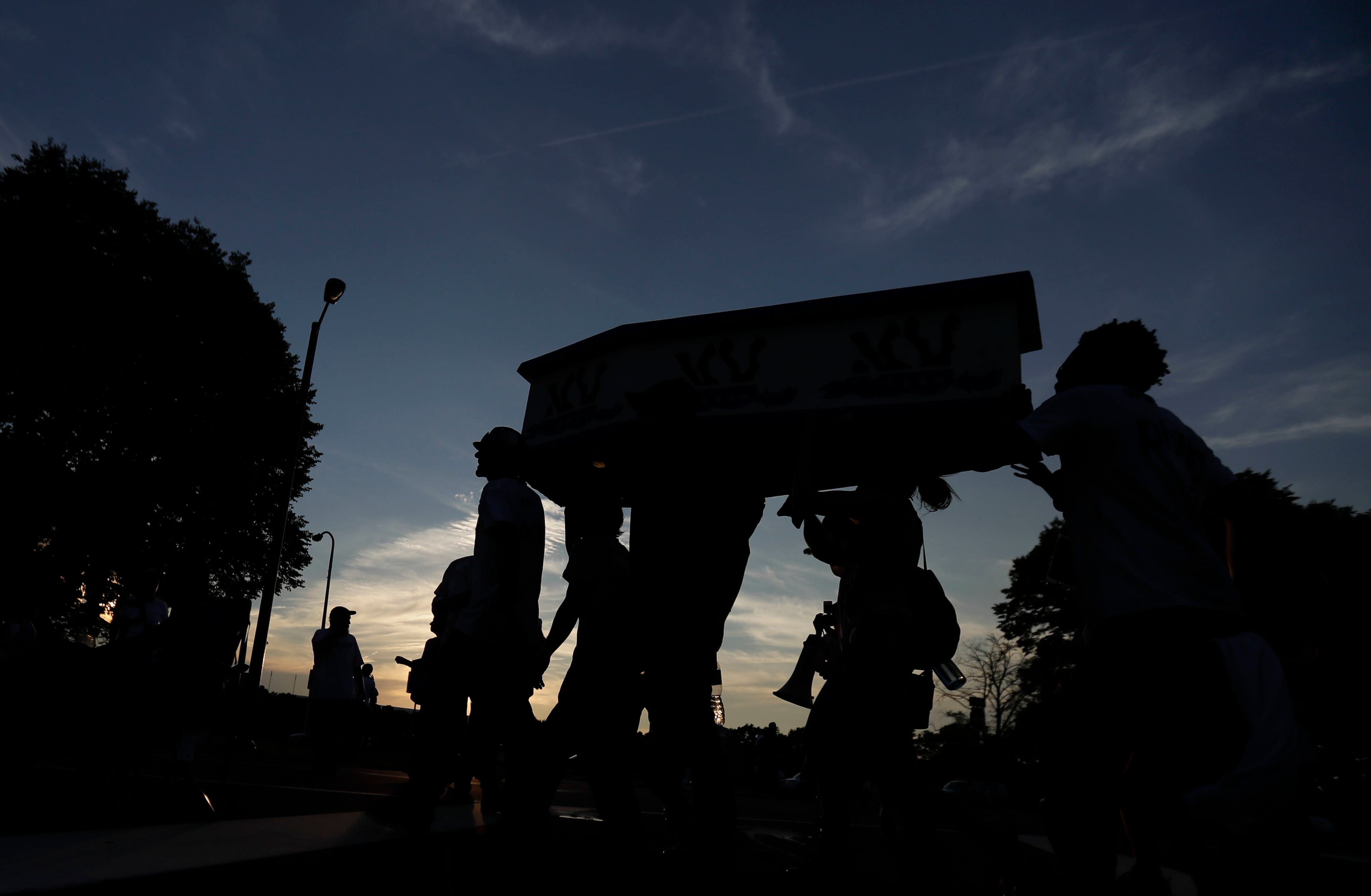 Protesters march near the AT&T Station in Philadelphia, Tuesday, July 26, 2016, during the second day of the Democratic National Convention. (AP Photo/Matt Slocum)