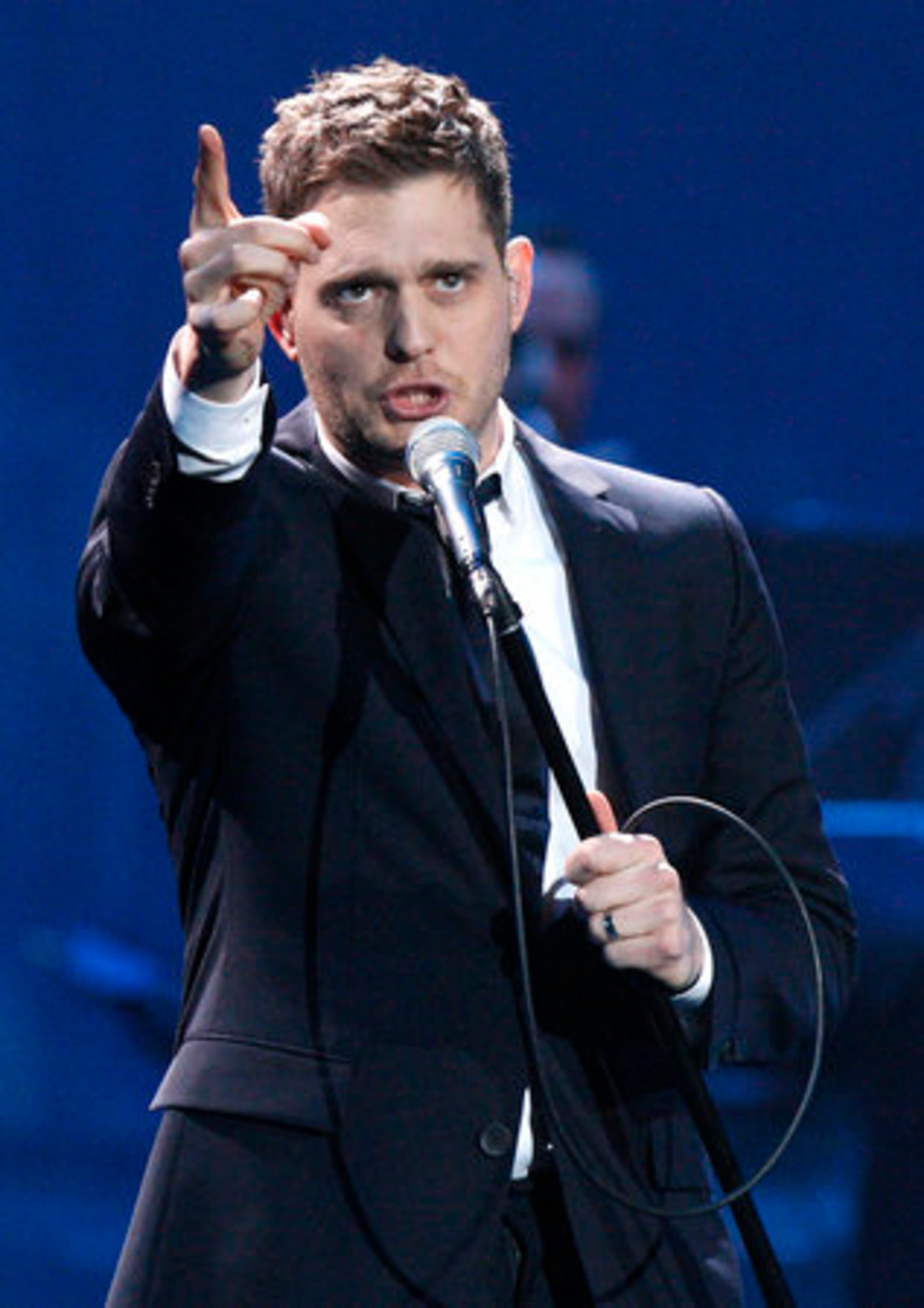 Michael Bubl points at people in the balcony. He has said one of the reasons he was ready to get back on tour was because he had missed the fans.