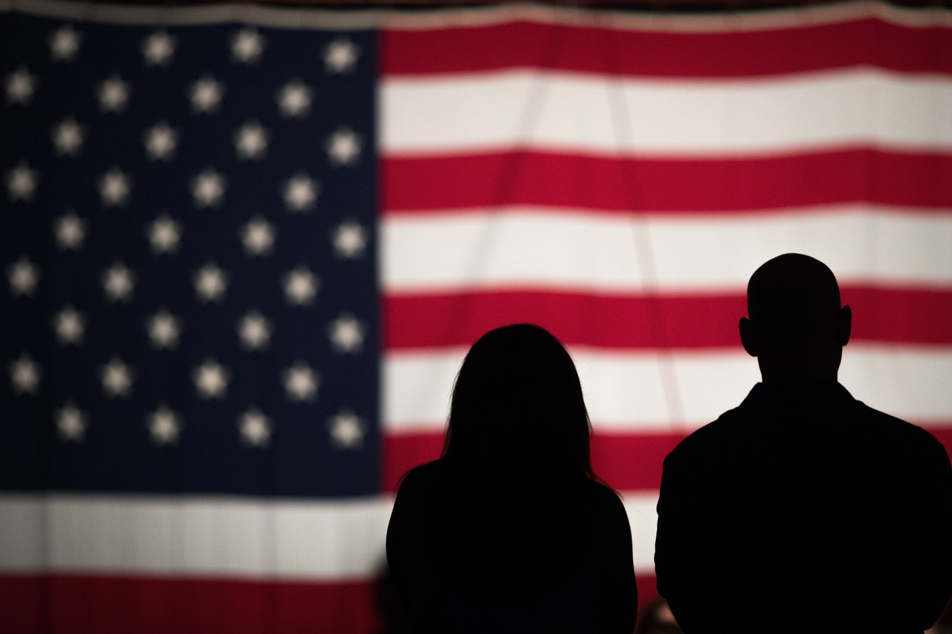 FLAG ON THE MALL--WASHINGTON, DC - MAY 27: A couple views a large American flag set up on the National Mall, May 27, 2016, in Washington, DC. Rolling Thunder members and supporters will participate in a motorcycle rally on Sunday afternoon in Washington. Rolling Thunder is an advocacy group that seeks to bring awareness to prisoners of war (POWs) and missing in action (MIA) service members of all U.S. wars. (Photo by Drew Angerer/Getty Images) ***BESTPIX***