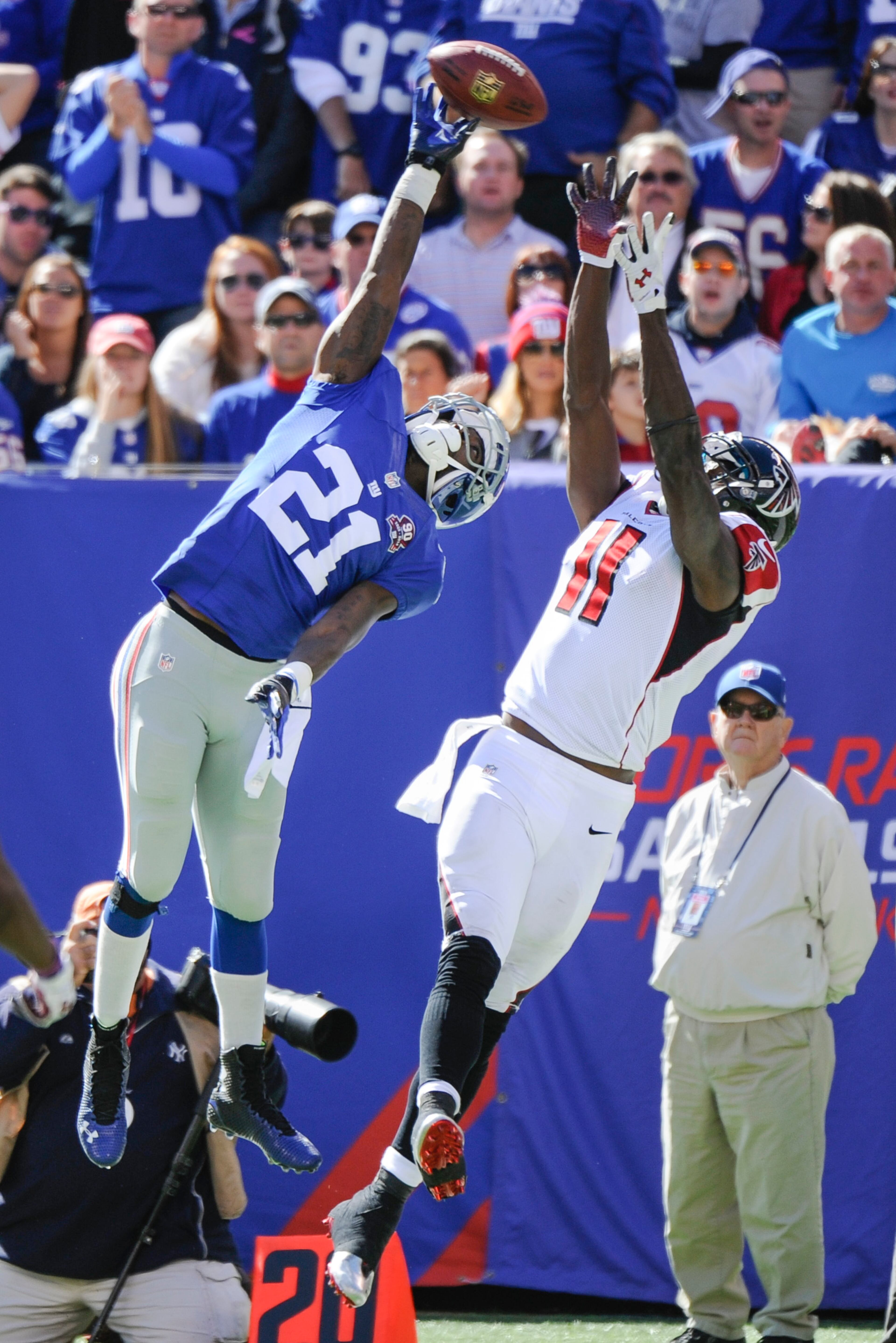 New York Giants cornerback Dominique Rodgers-Cromartie (21) deflects a pass intended for Atlanta Falcons wide receiver Julio Jones (11) during the first half of an NFL football game, Sunday, Oct. 5, 2014, in East Rutherford, N.J. (AP Photo/Bill Kostroun)