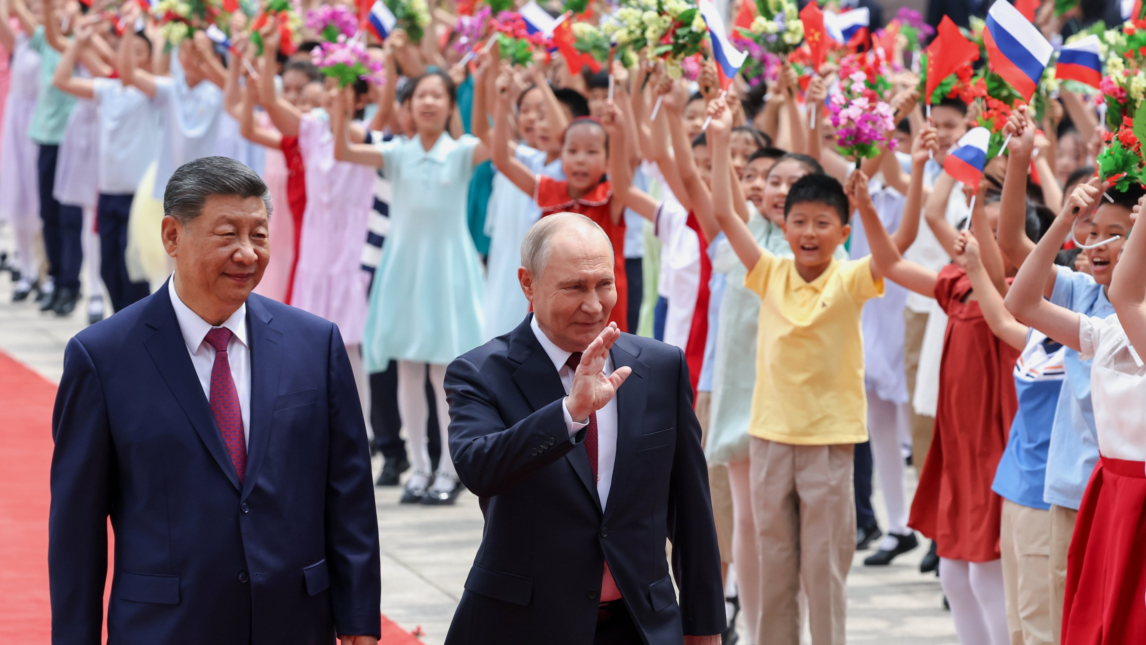 Russian President Vladimir Putin, center, and Chinese President Xi Jinping attend a welcome ceremony at the Great Hall of the People, in Beijing, China, on Wednesday, May 20, 2026. (Alexander Kazakov, Sputnik, Kremlin Pool Photo via AP)