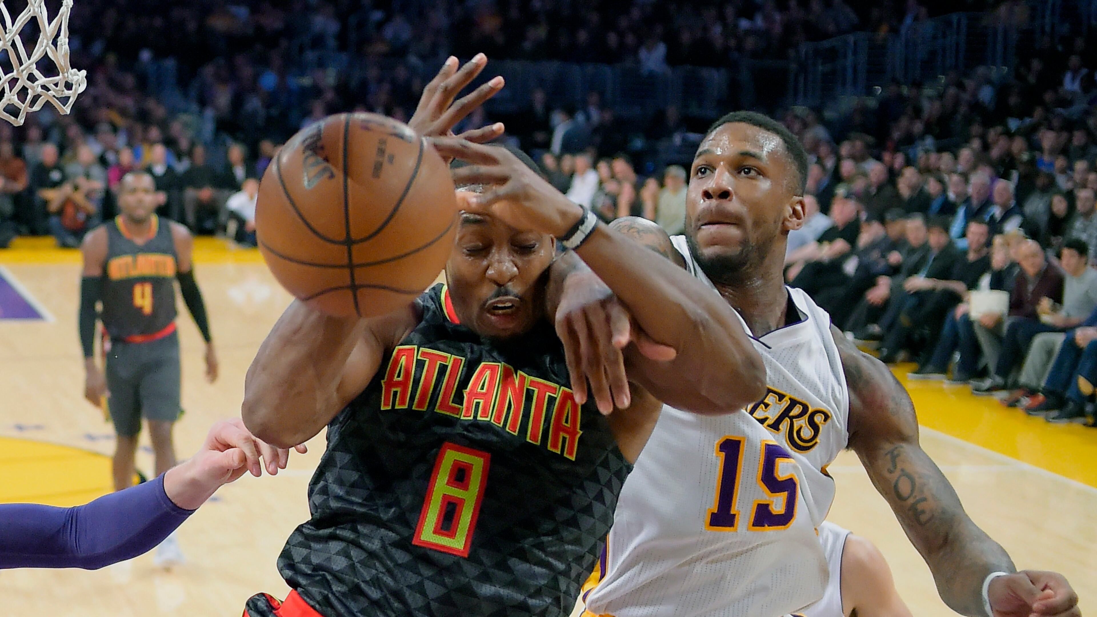Atlanta Hawks center Dwight Howard, left, and Los Angeles Lakers forward Thomas Robinson battle for a rebound during the first half of an NBA basketball game Sunday, Nov. 27, 2016, in Los Angeles. (AP Photo/Mark J. Terrill)