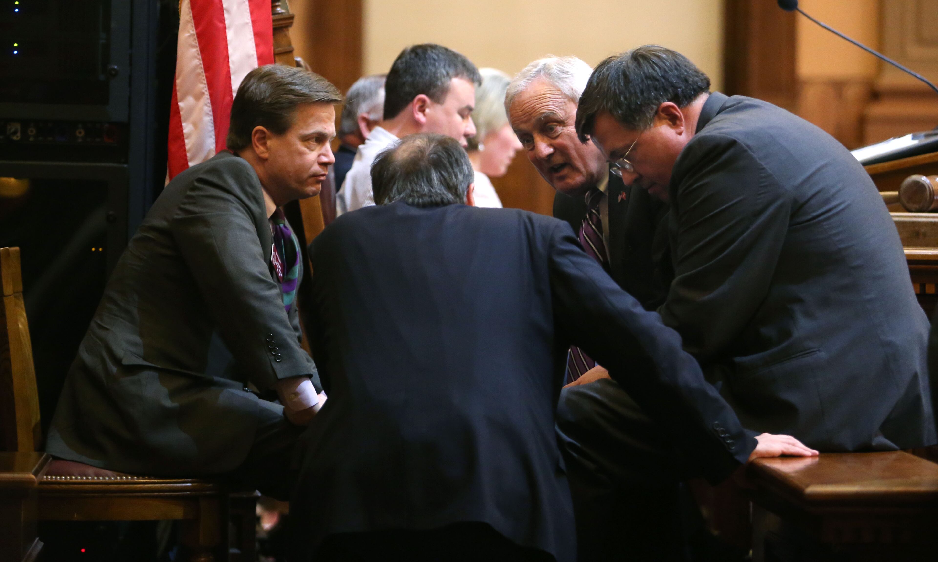 Members of the House leadership huddle, including Rep. Rich Golick, R-Smyrna, left, Majority Whip Edward Lindsey, R-Atlanta, center, House Rules Chairman John Meadows, R-Calhoun, second from right, and Rep. Rick Jasperse, R-Jasper, right.
