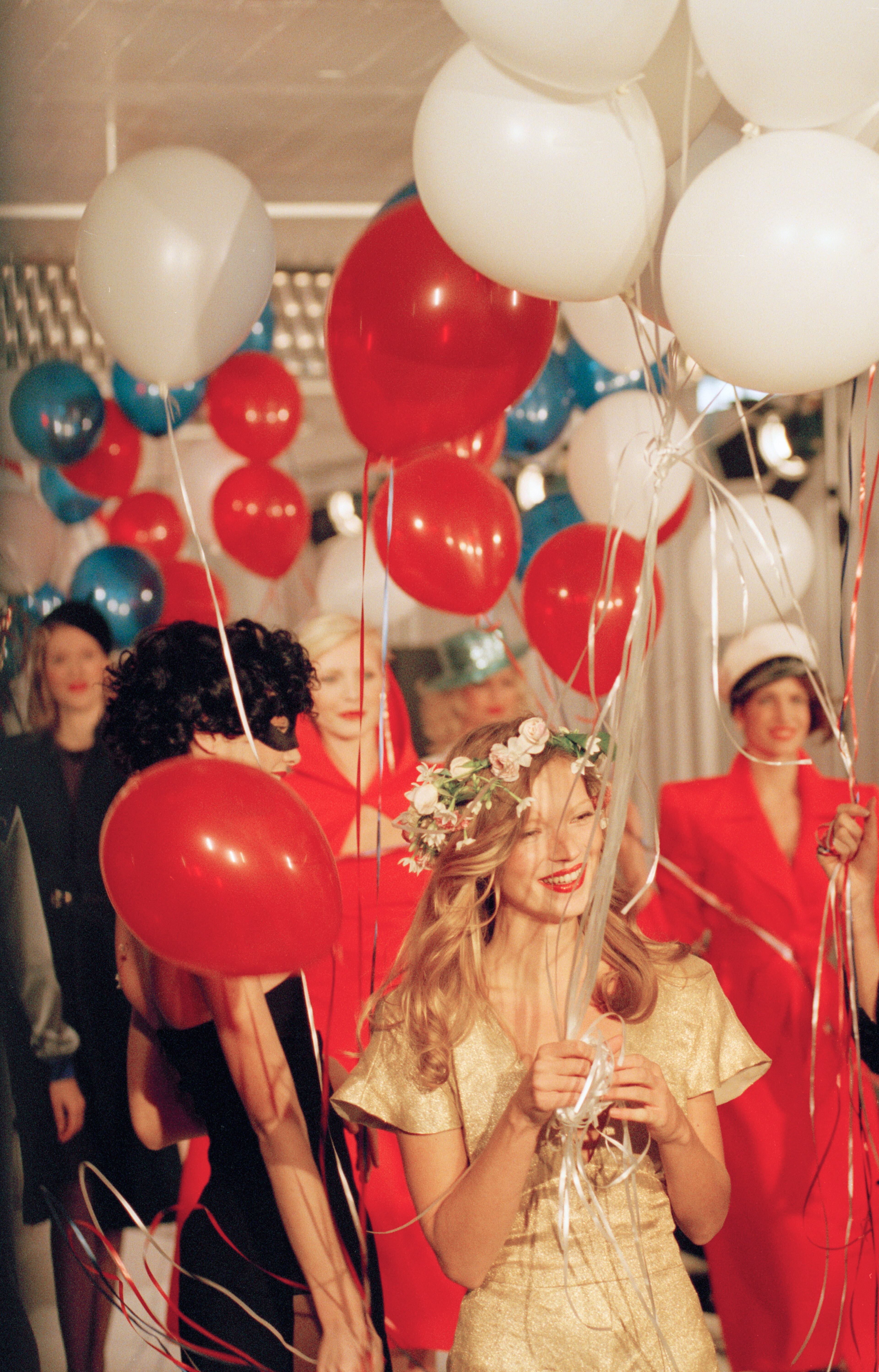 Kate Moss leads models down the runway at the close of Marc Jacobs' spring fashion show in the Tribeca section of New York, Oct. 29, 1994.