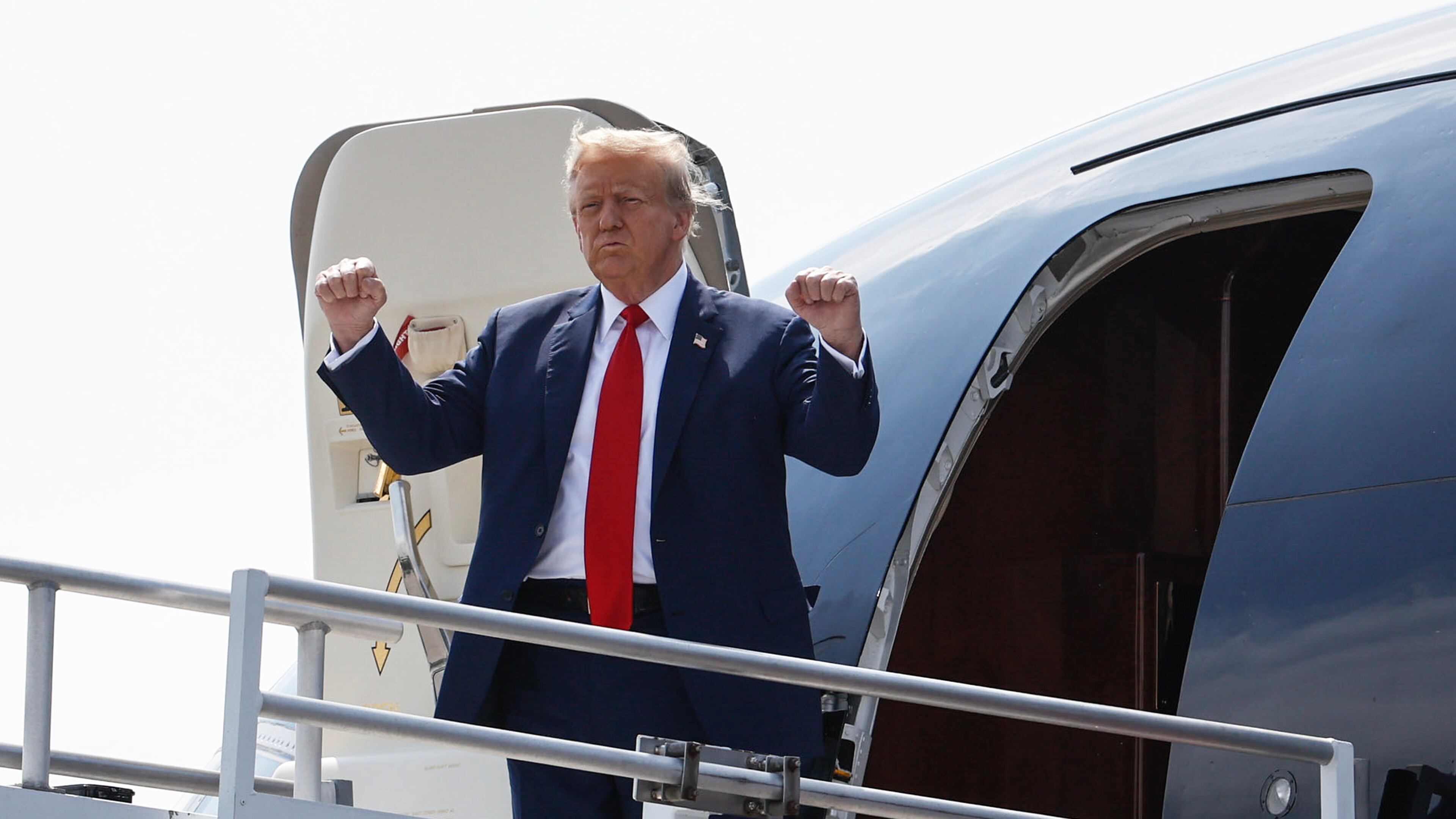 Former President Donald Trump arrives at Hartsfield-Jackson International Airport on Wednesday.