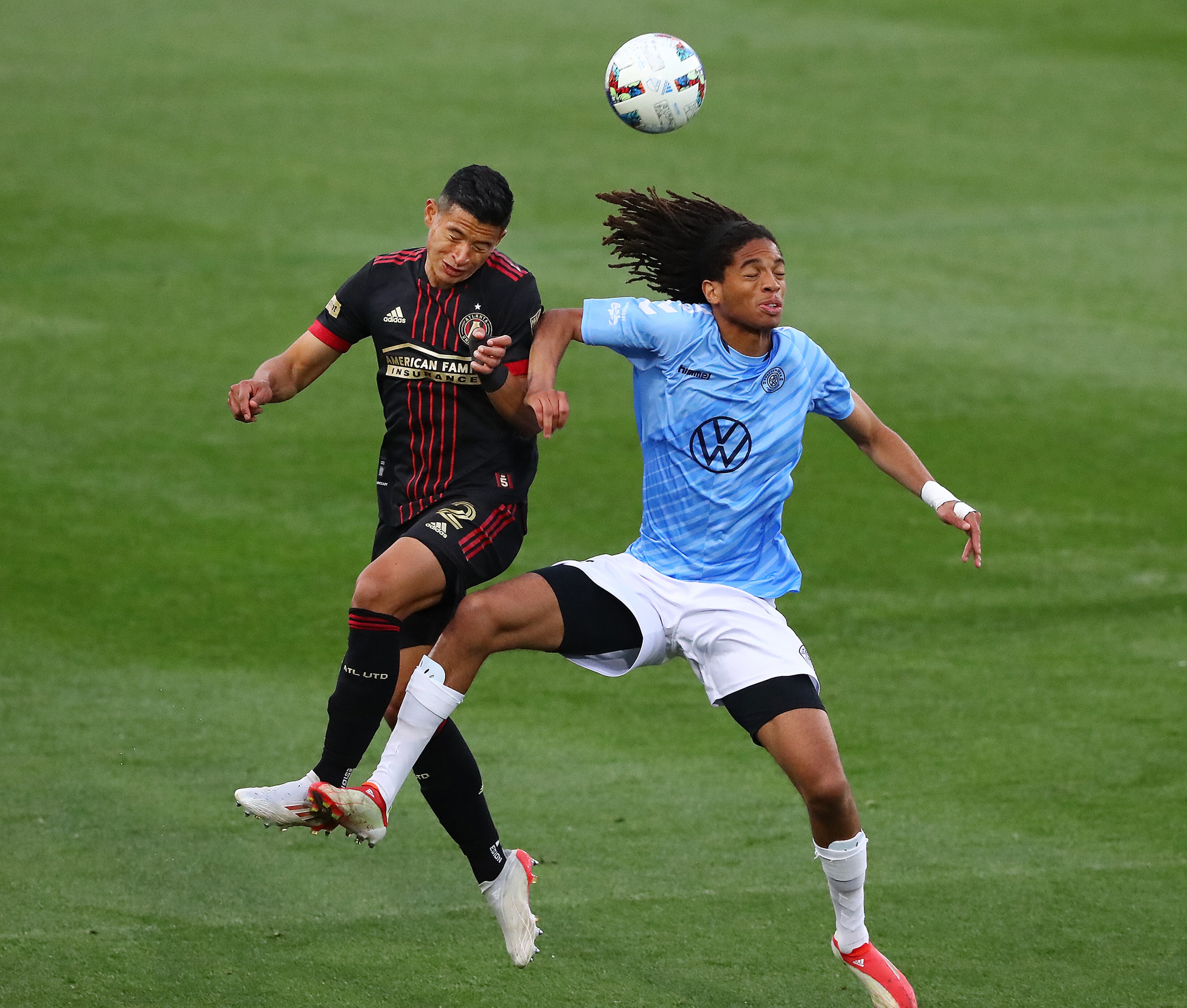 Atlanta United defender Ronald Hernandez and Chattanooga FC defender Taylor Gray collide going for a header in the Lamar Hunt U.S. Open Cup on Wednesday, April 20, 2022, in Kennesaw. “Curtis Compton / Curtis.Compton@ajc.com”