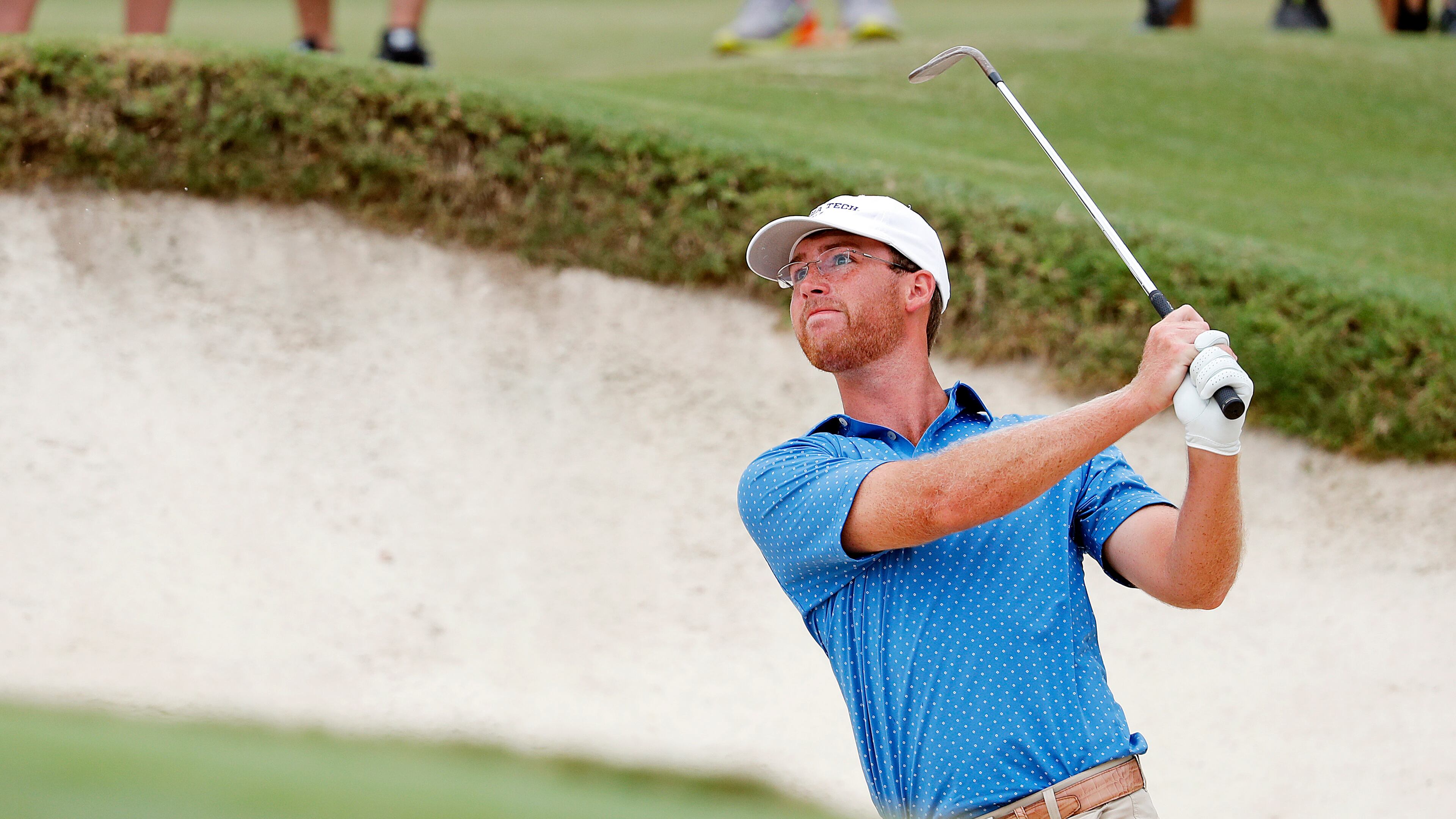 Andy Ogletree uses two strong thumbs to escape a bunker during his U.S. Amateur final against John Augenstein last year. (AP Photo/Karl B DeBlaker)