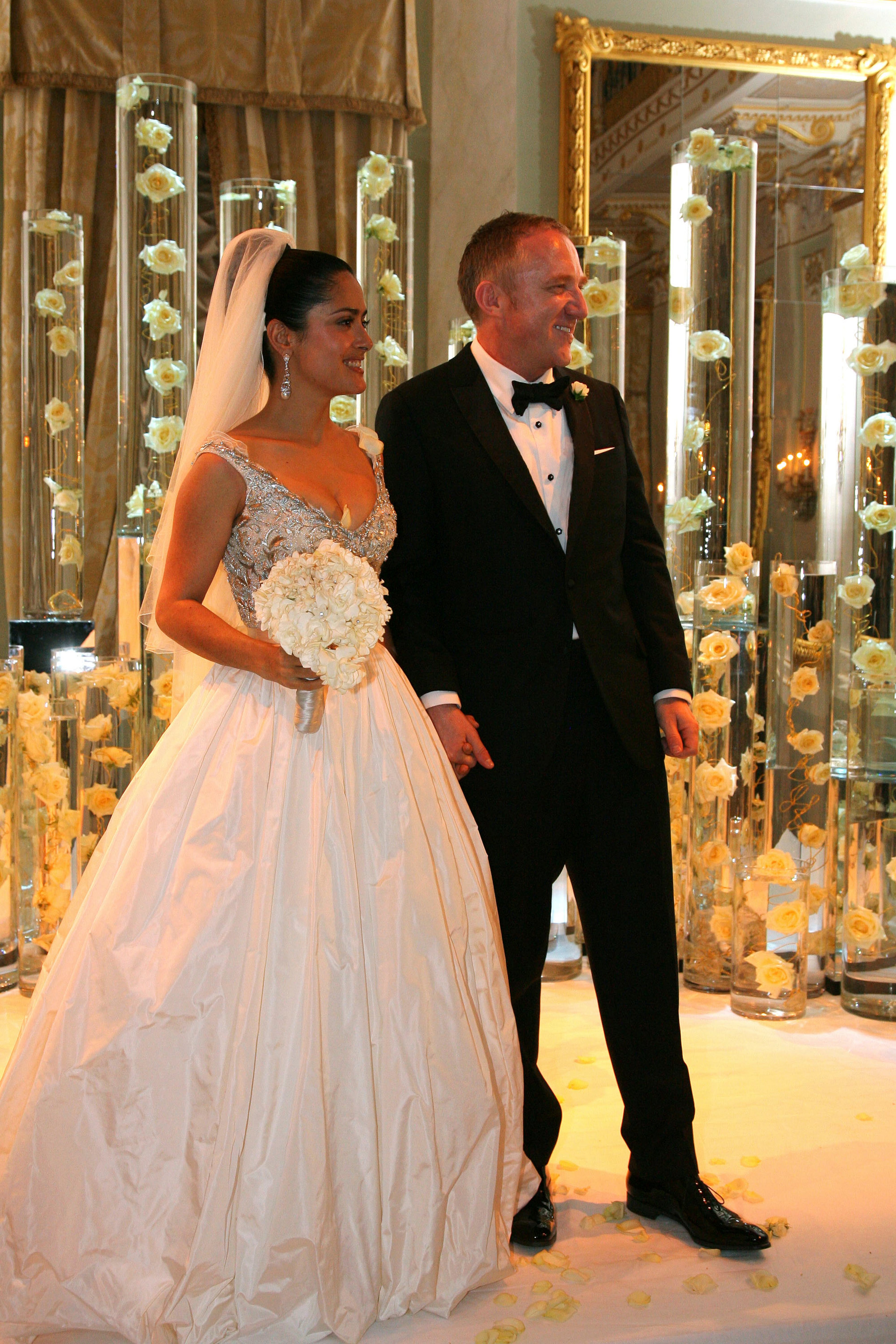 Actress Salma Hayek and businessman Francois-Henri Pinault threw a $3.5 million reception in 2009 after marrying earlier in the year in a civil ceremony. The party featured a masked ball and a performance by Bono. STATUS: Married with one child together. (AP Photo/Bertrand Rindoff-Petroff)