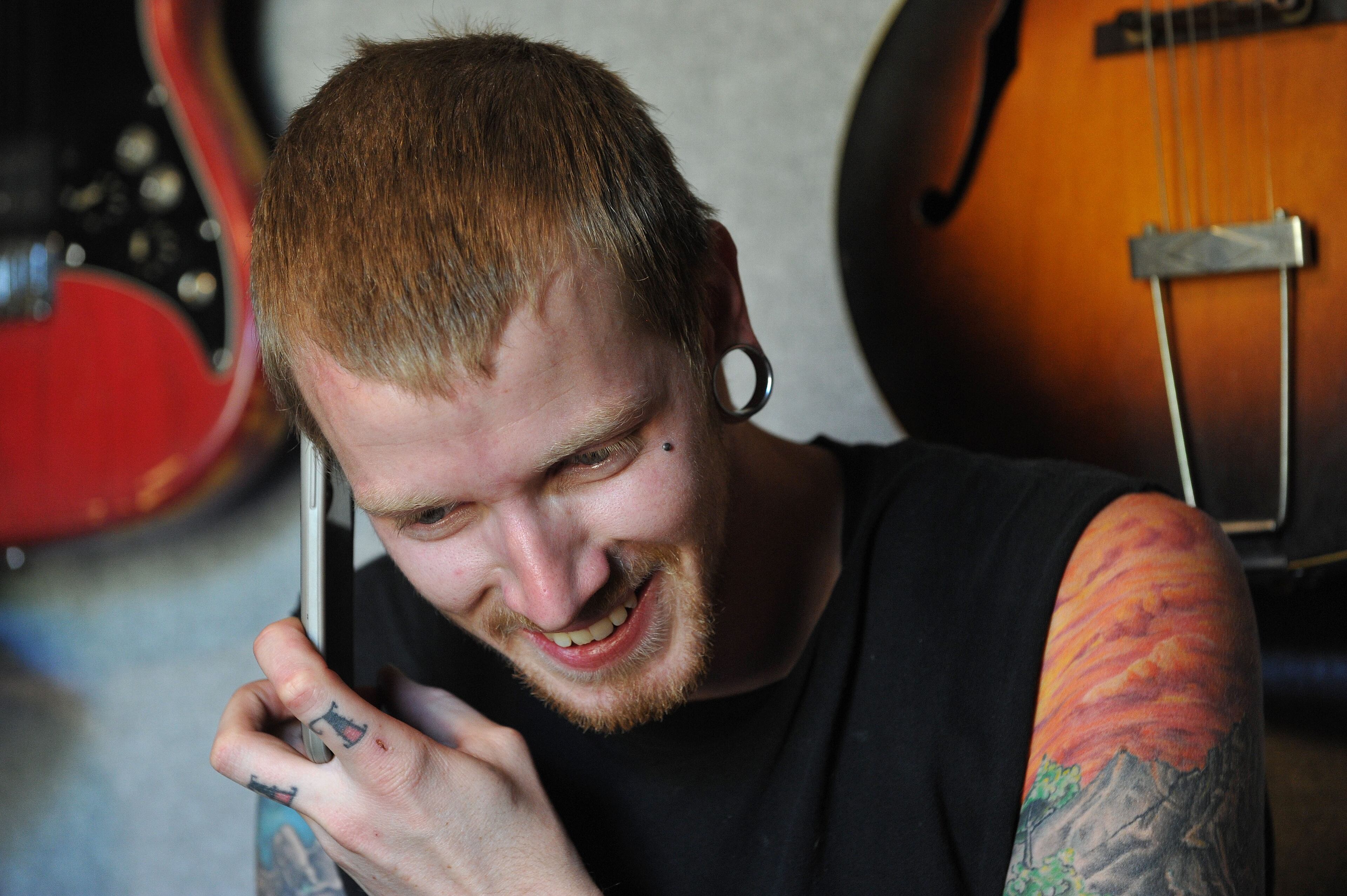 Musician Jason Barnes calls a friend from his house on Tuesday April 1, 2014 in Locust Grove, Ga. David Tulis / AJC Special