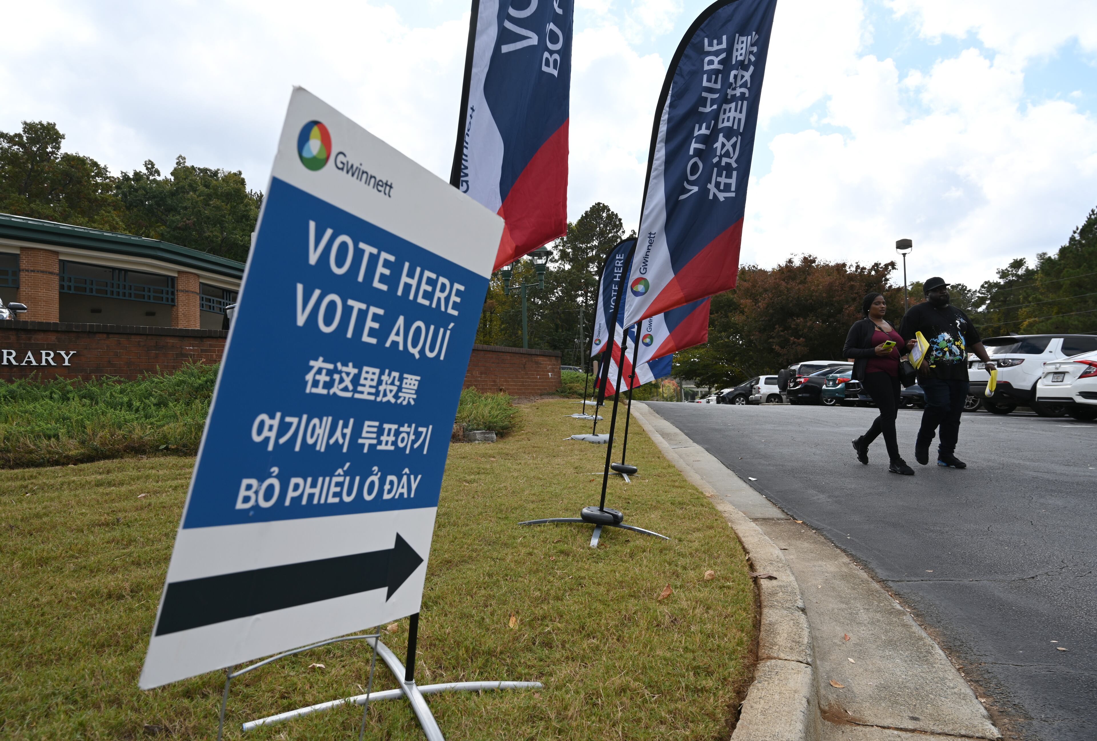 Gwinnett County voters cast their ballots Wednesday during early in-person voting at Five Forks Branch Library in Lawrenceville. Hyosub Shin/AJC