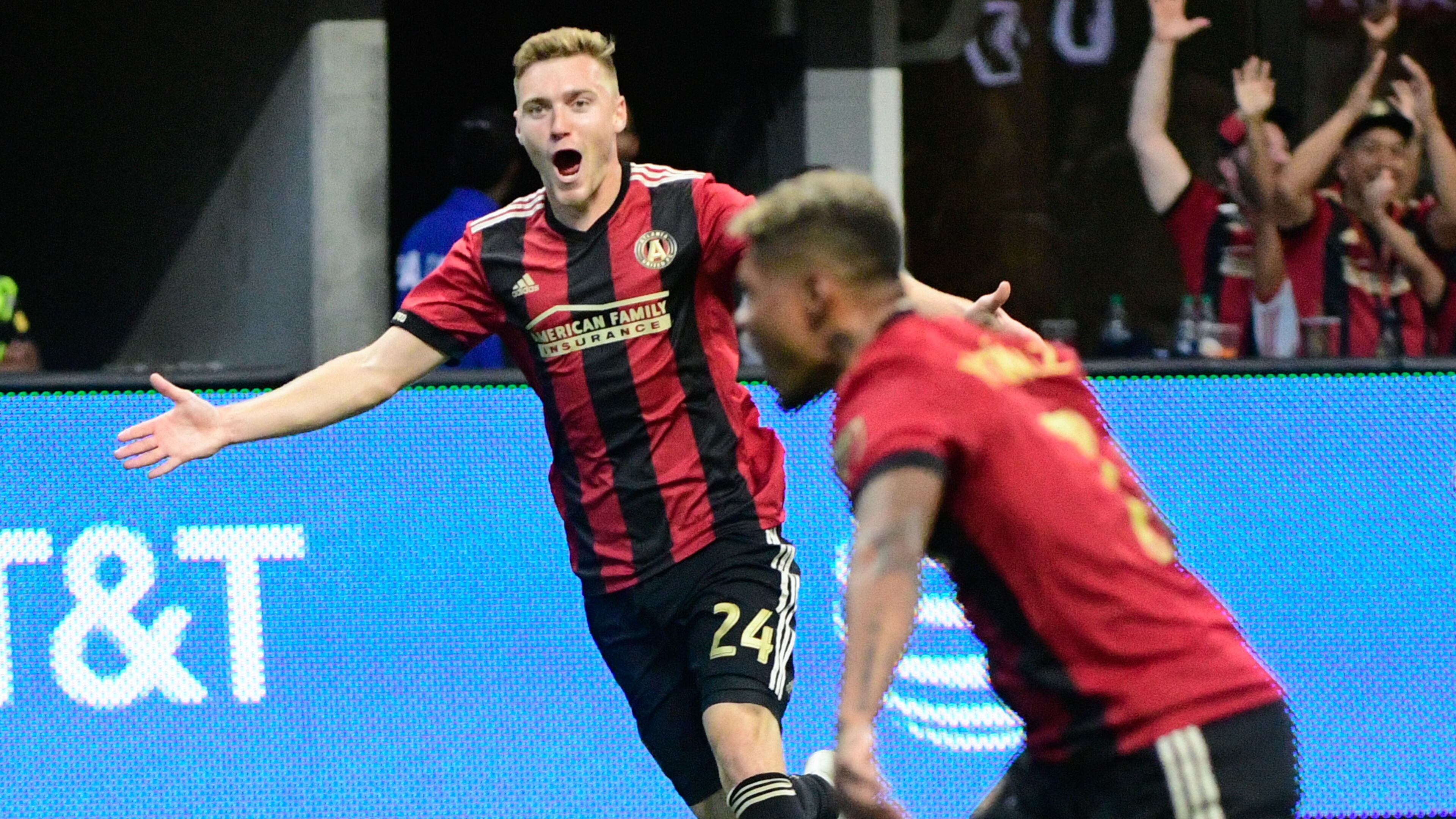 Atlanta United's Julian Gressel rejoices in teammate George Bello's goal earlier this month against the New England Revolution. (John Amis)