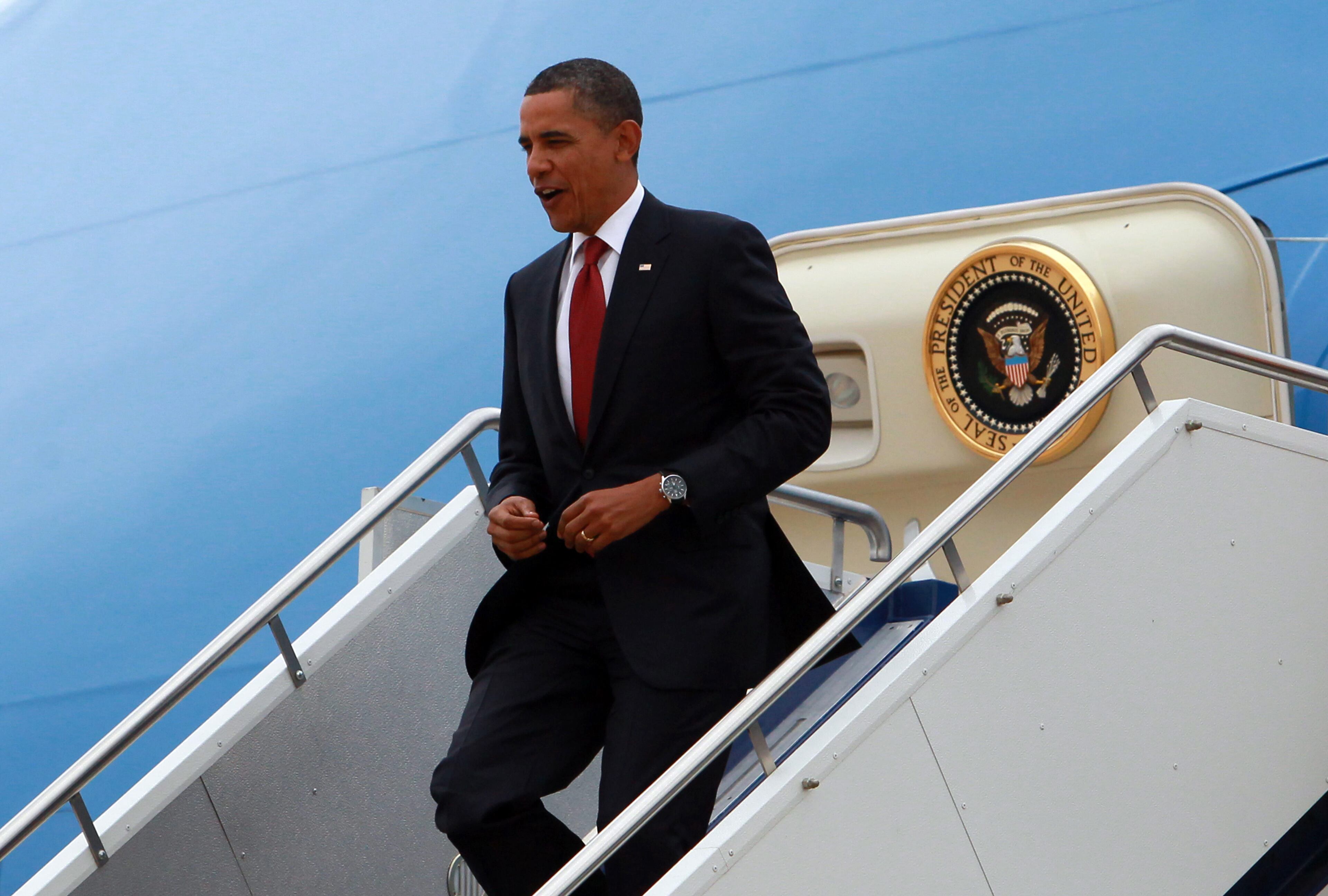 U.S. President Barack Obama descends a staircase as he disembarks from Air Force One during his arrival at Fairbairn Defence Establishment on the first day of his 2-day visit to Australia, on November 16, 2011 in Canberra, Australia. The President will today receive a Cermeonial Welcome, attend a bi-lateral meeting and hold a joint media conference with Julia Gillard, and attend a Parliamentary Dinner this evening, before addressing Parliament and heading to Darwin tomorrow. (Photo by Stuart McEvoy - Pool/Getty Images)