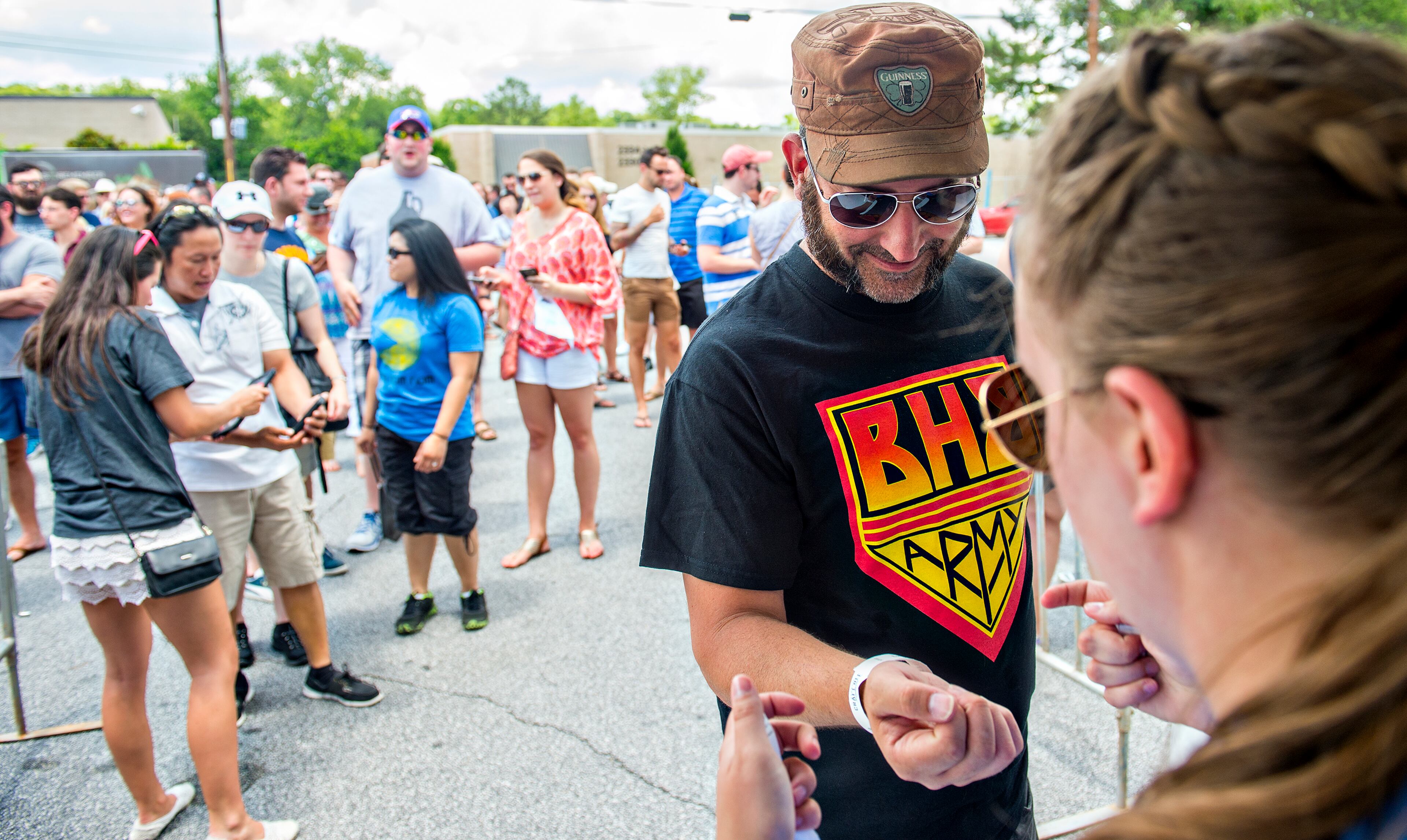 May 30, 2015 Atlanta - Todd Major gets his armband as he enters the Georgia Craft Beer Festival outside of Red Brick Brewing in Atlanta on Saturday, May 30, 2015. Hundreds of people came out to taste beer from 30 local Georgia breweries. JONATHAN PHILLIPS / SPECIAL
