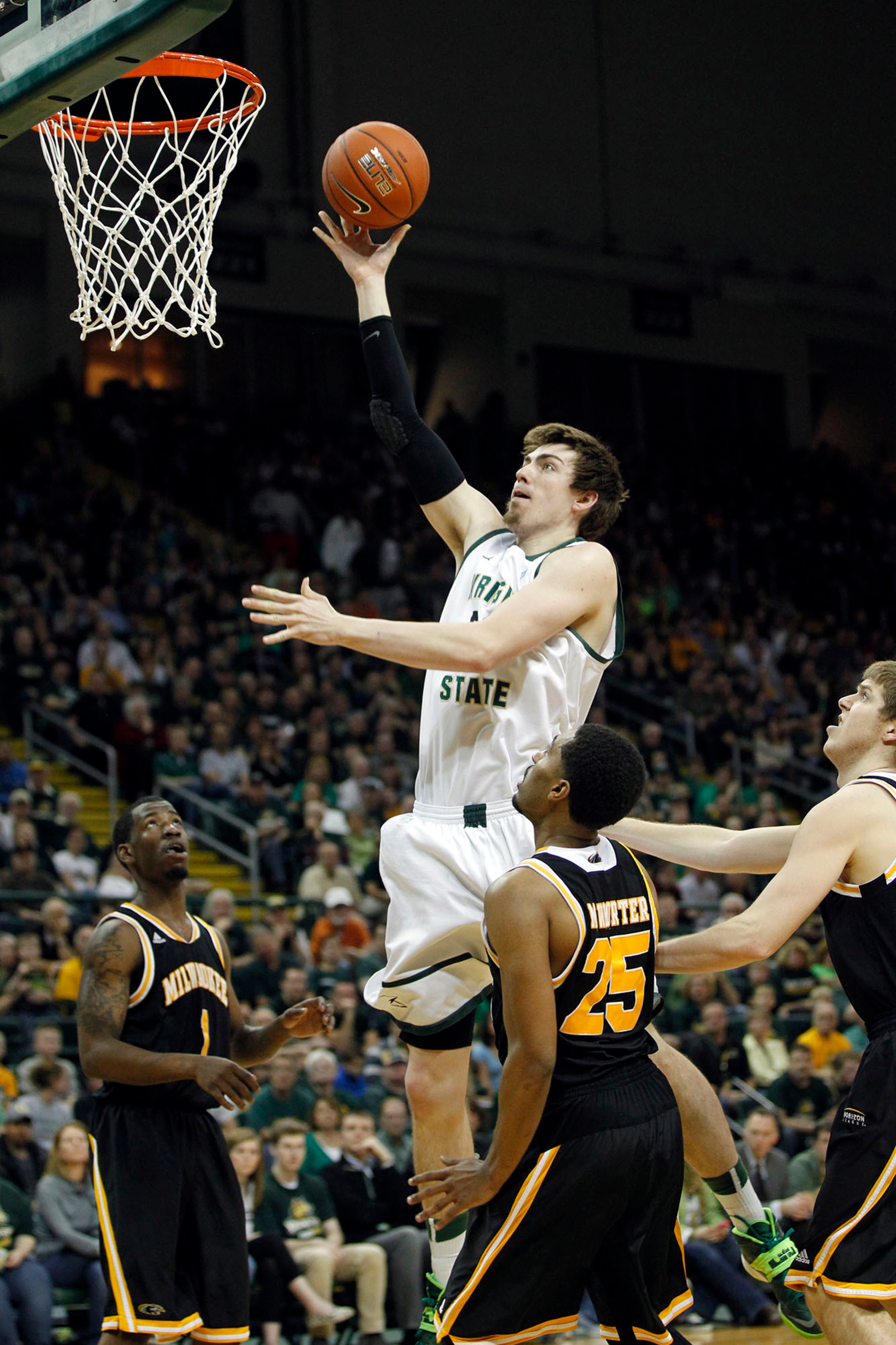 Wright State's AJ Pacher with a layup as the Raiders hosted the Panthers for the Horizon League Championship. TY GREENLEES / STAFF
