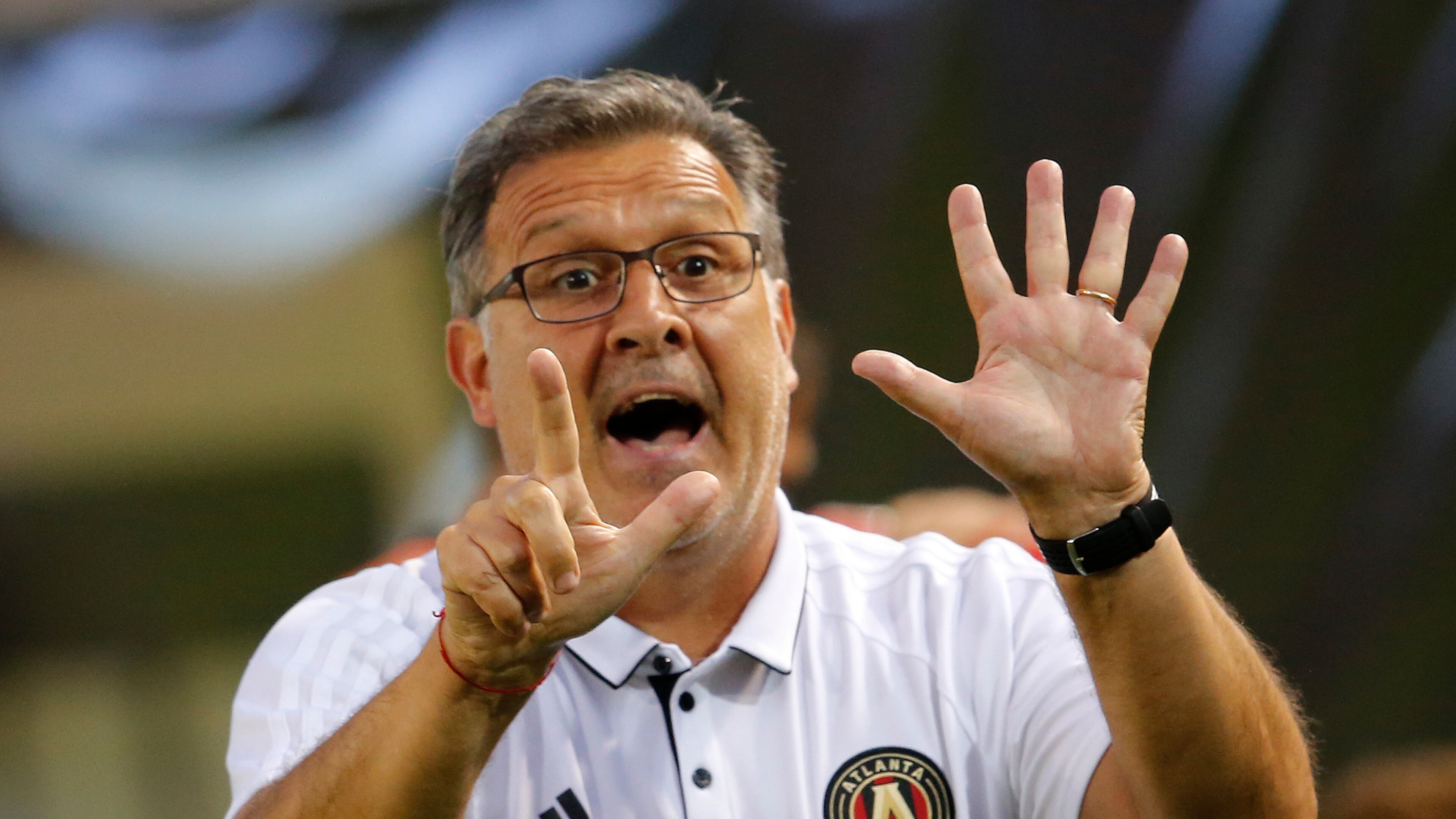 Atlanta United head coach Gerardo “Tata” Martino signals to his players in the second half of an MLS soccer match against the Columbus Crew Saturday, June 17, 2017, in Atlanta (AP Photo/John Bazemore)