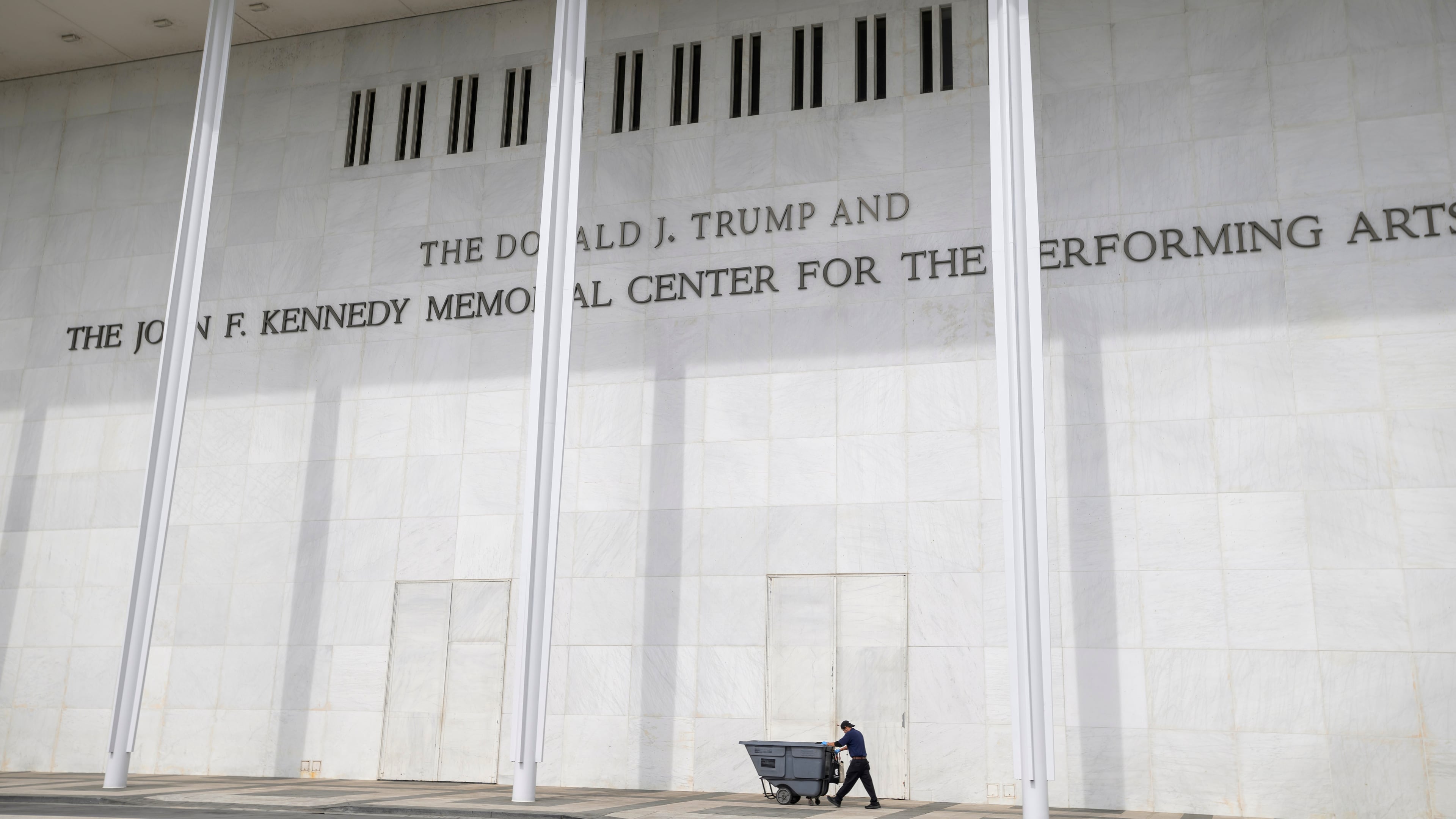 A man wheels a garbage bin outside of The John. F. Kennedy Center for the Performing Arts, Saturday, June 6, 2026, in Washington. (AP Photo/Rod Lamkey, Jr.)