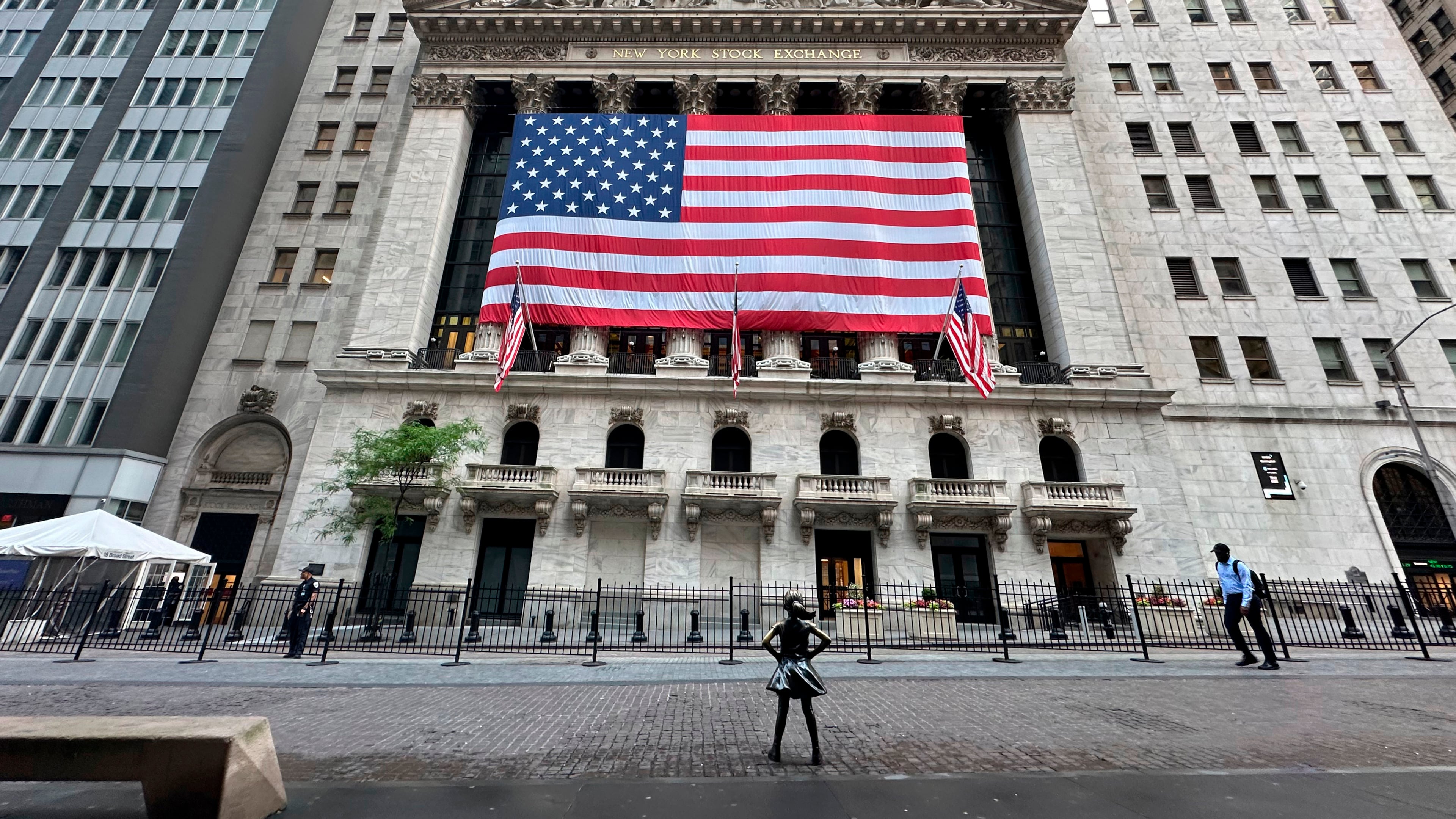 FILE - People pass the New York Stock Exchange on May 28, 2024, in New York. (AP Photo/Peter Morgan, File)